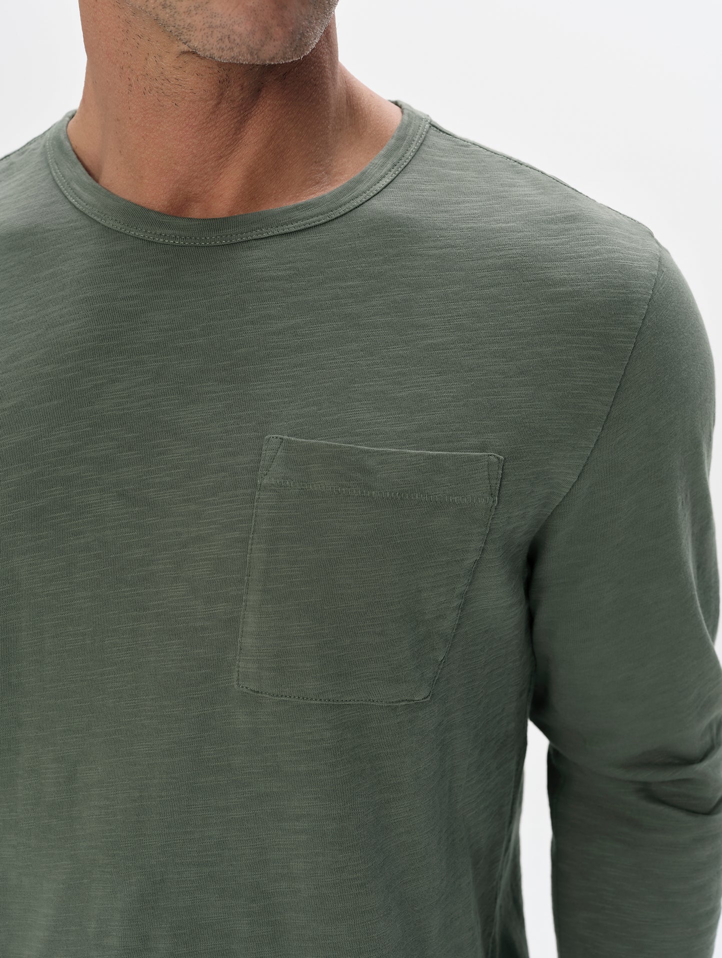 Closeup detailed view of the shoulder and patch pocket on the Slub Pocket Long-Sleeve Tee 2.0 in Gunmetal from AETHER Apparel.
