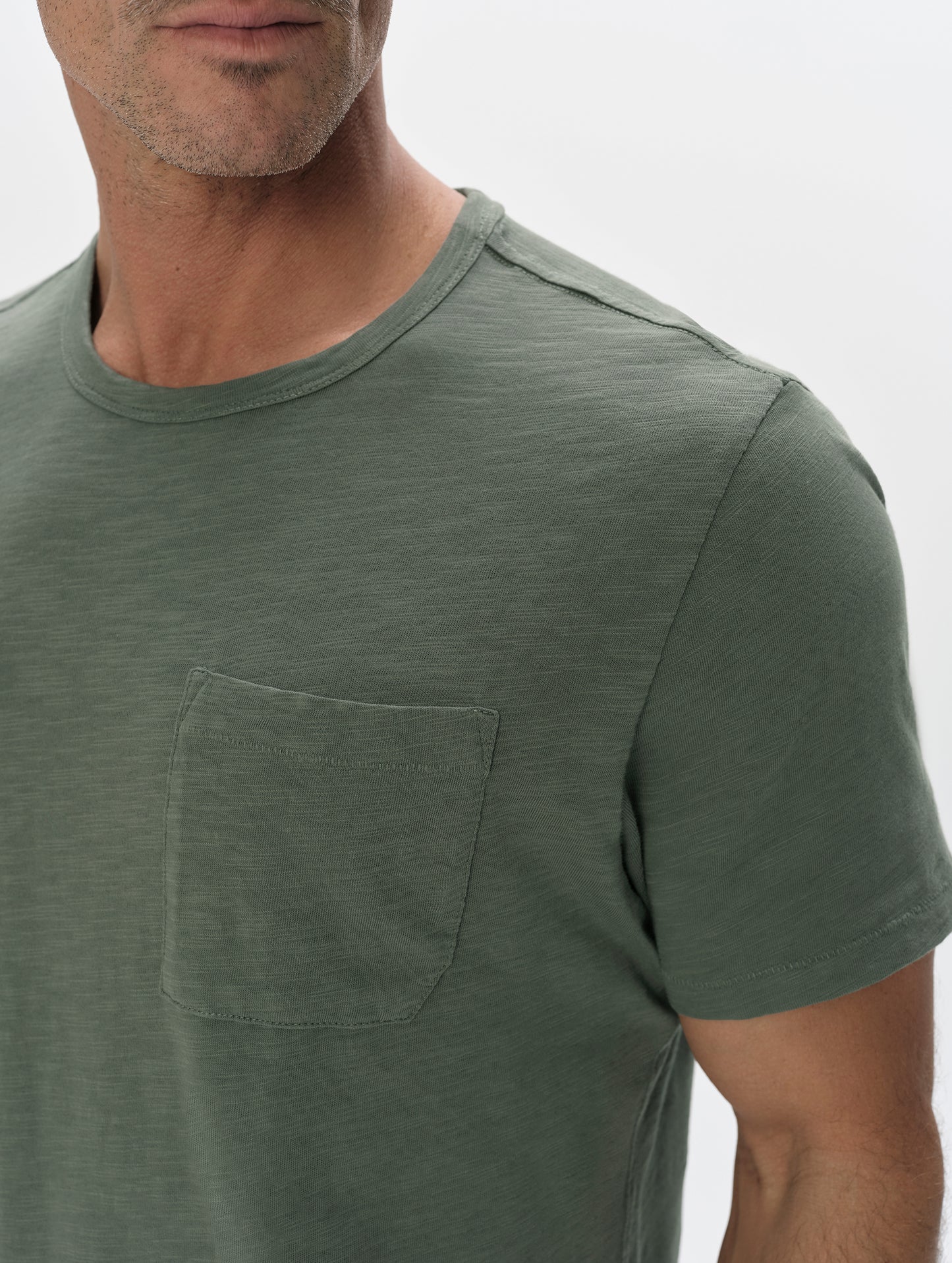 Closeup detailed view of the shoulder and patch pocket on the Slub Pocket Tee 2.0 in Gunmetal from AETHER Apparel.