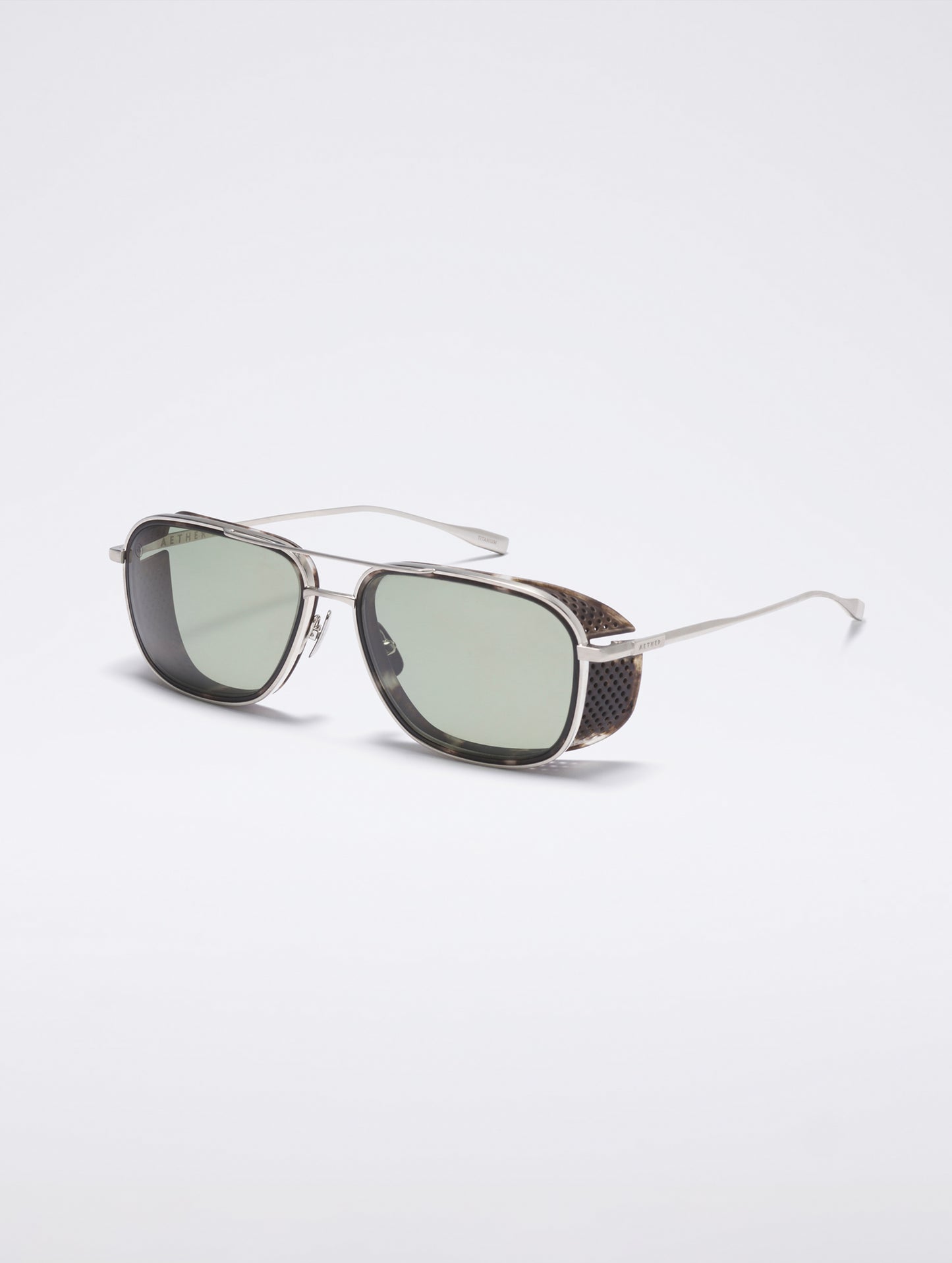 Front 3/4 view of Summit Sunglass in Brushed Silver titanium with Grey Lens from AETHER Apparel.