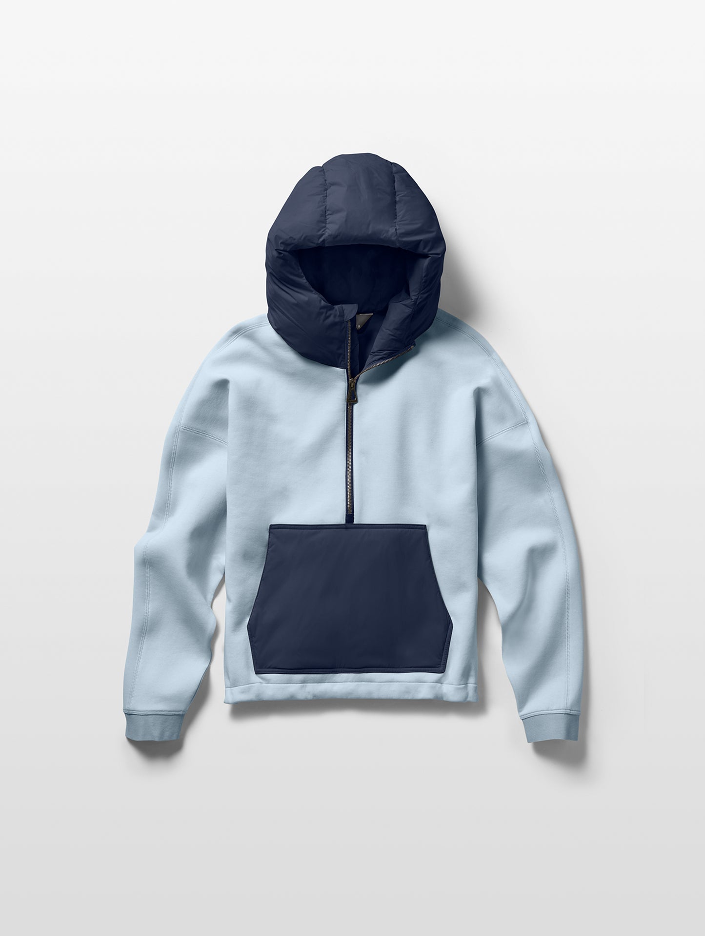 Flay lay of women's Align Hooded Anorak in Flight Blue from AETHER Apparel.