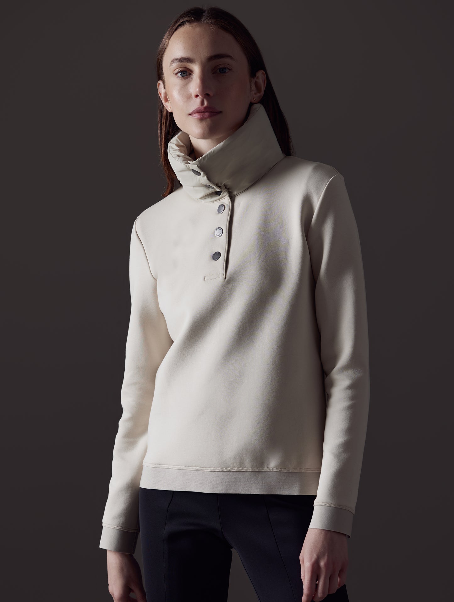 Woman wearing beige Align Pullover from AETHER Apparel