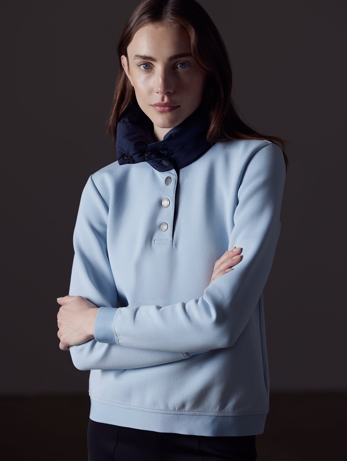Woman wearing light blue Align Pullover from AETHER Apparel