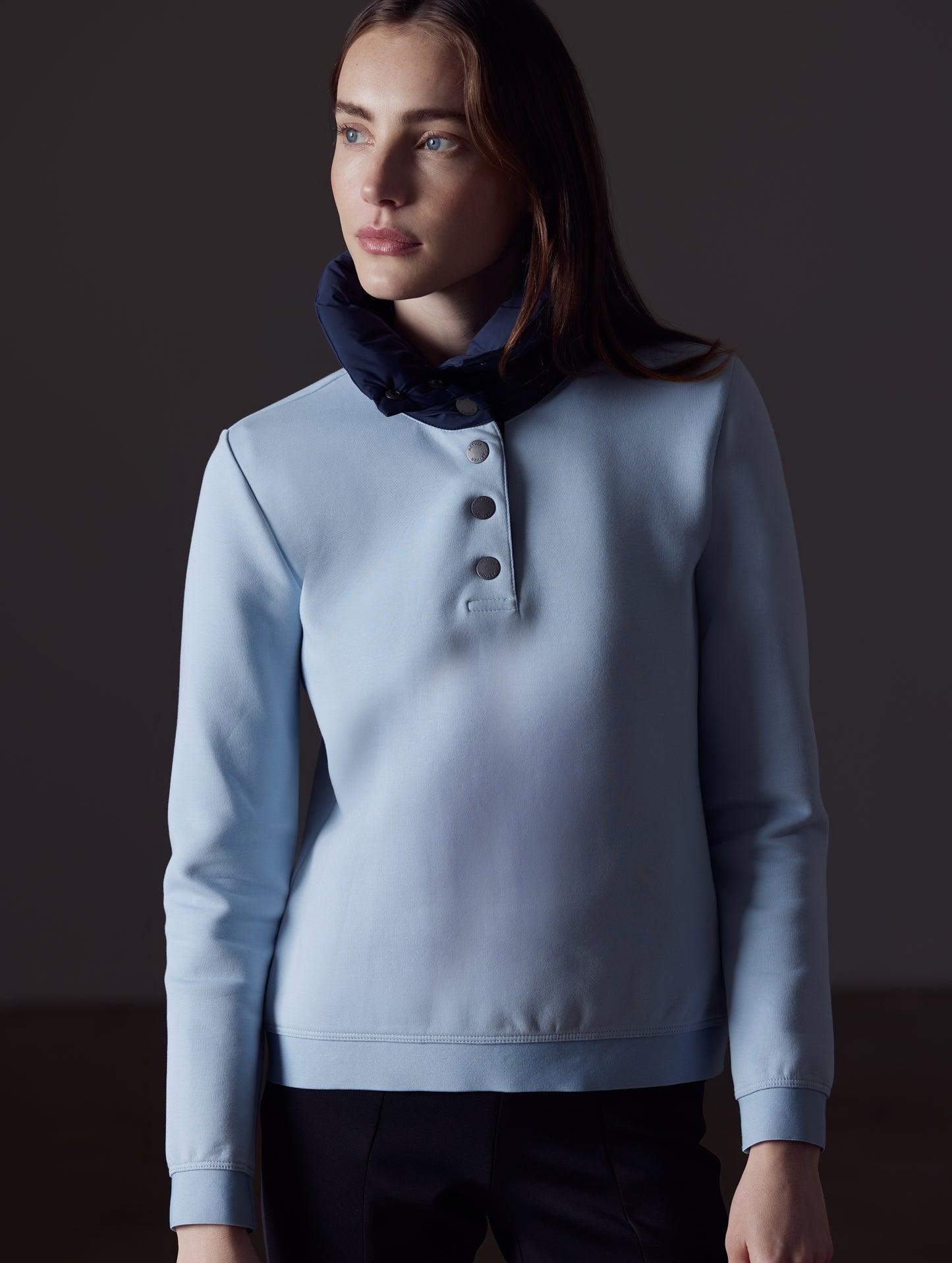 Woman wearing light blue Align Pullover from AETHER Apparel