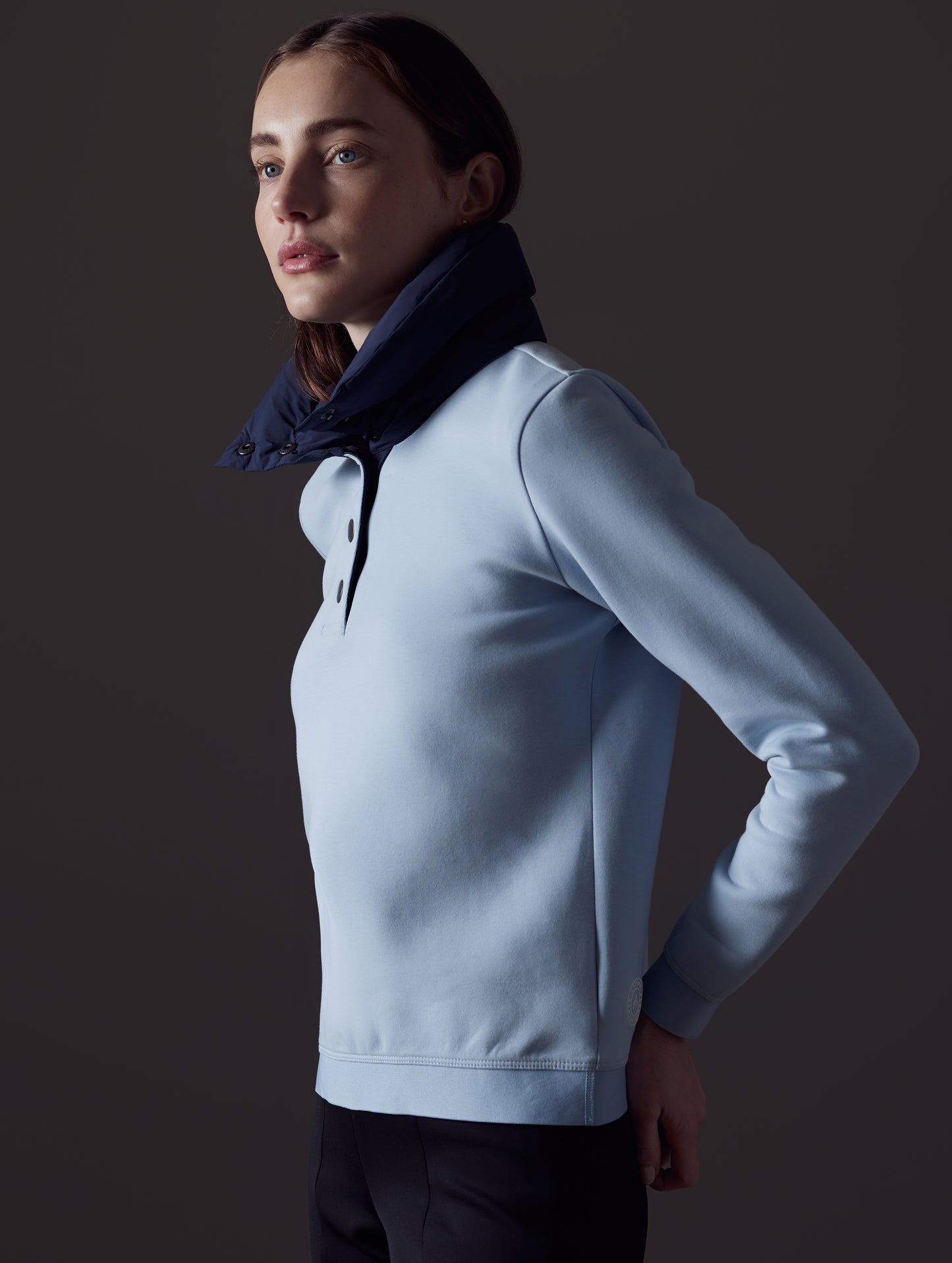 Woman wearing light blue Align Pullover from AETHER Apparel