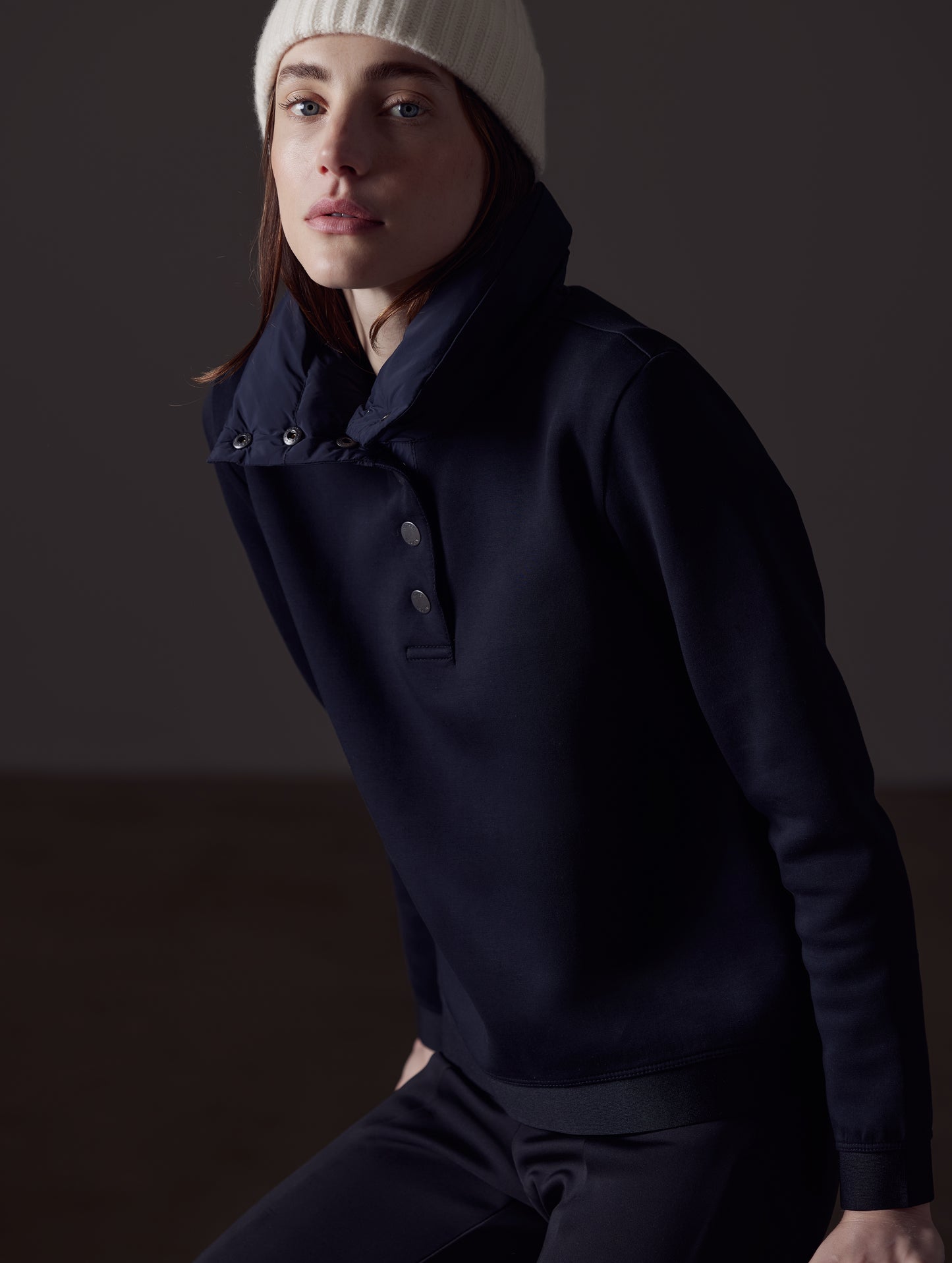 Woman wearing black Align Pullover from AETHER Apparel