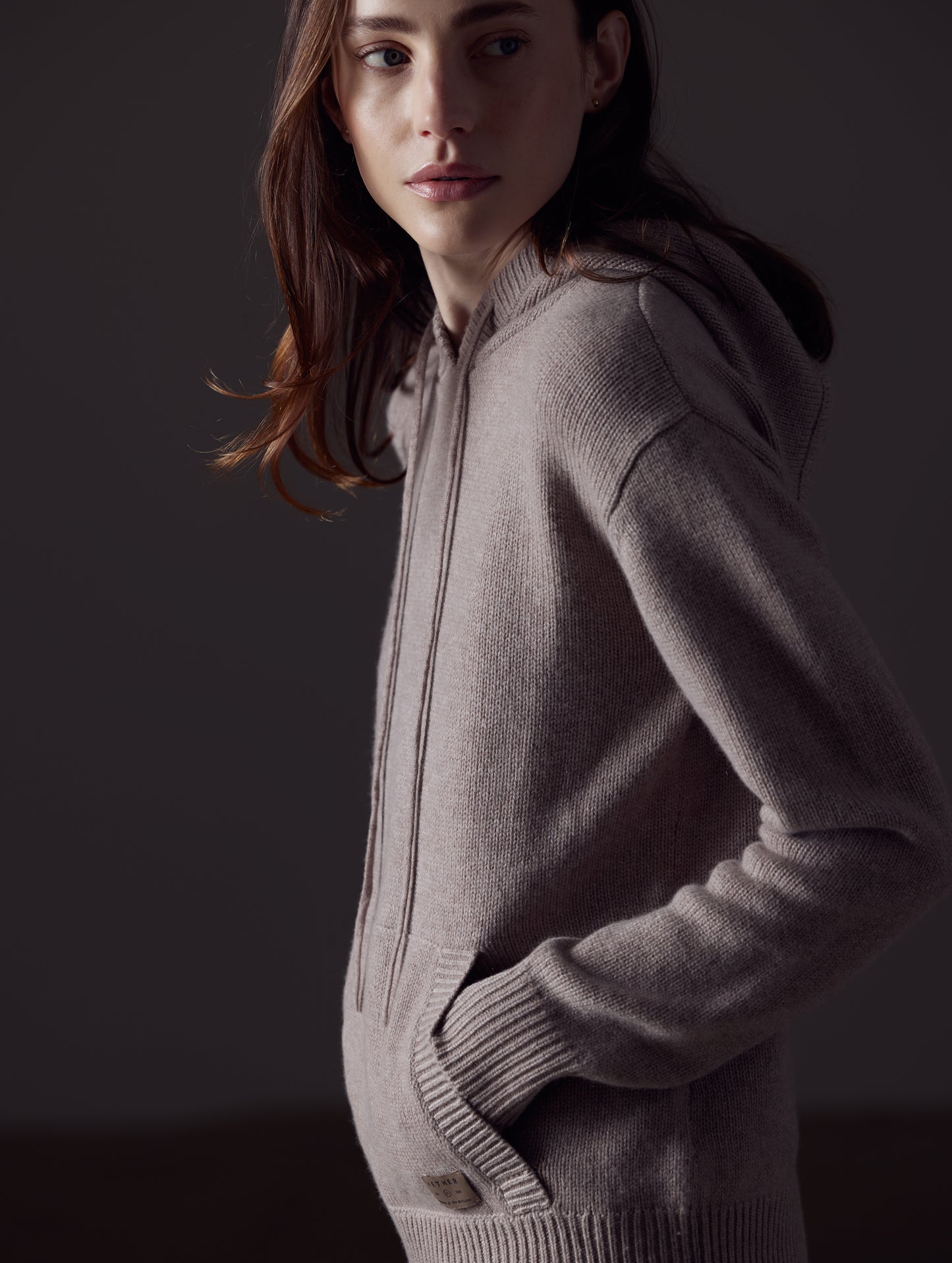 Woman wearing light brown Ava Cashmere Hooded Sweater