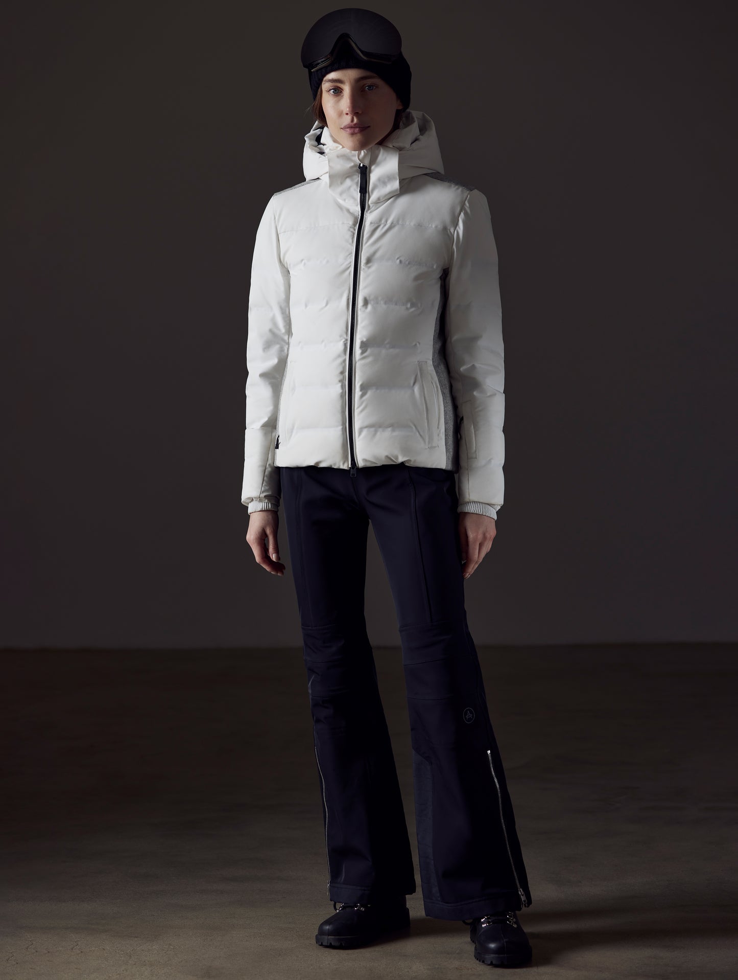 Front full-body view of woman wearing Bancroft Snow Jacket in White from AETHER Apparel.