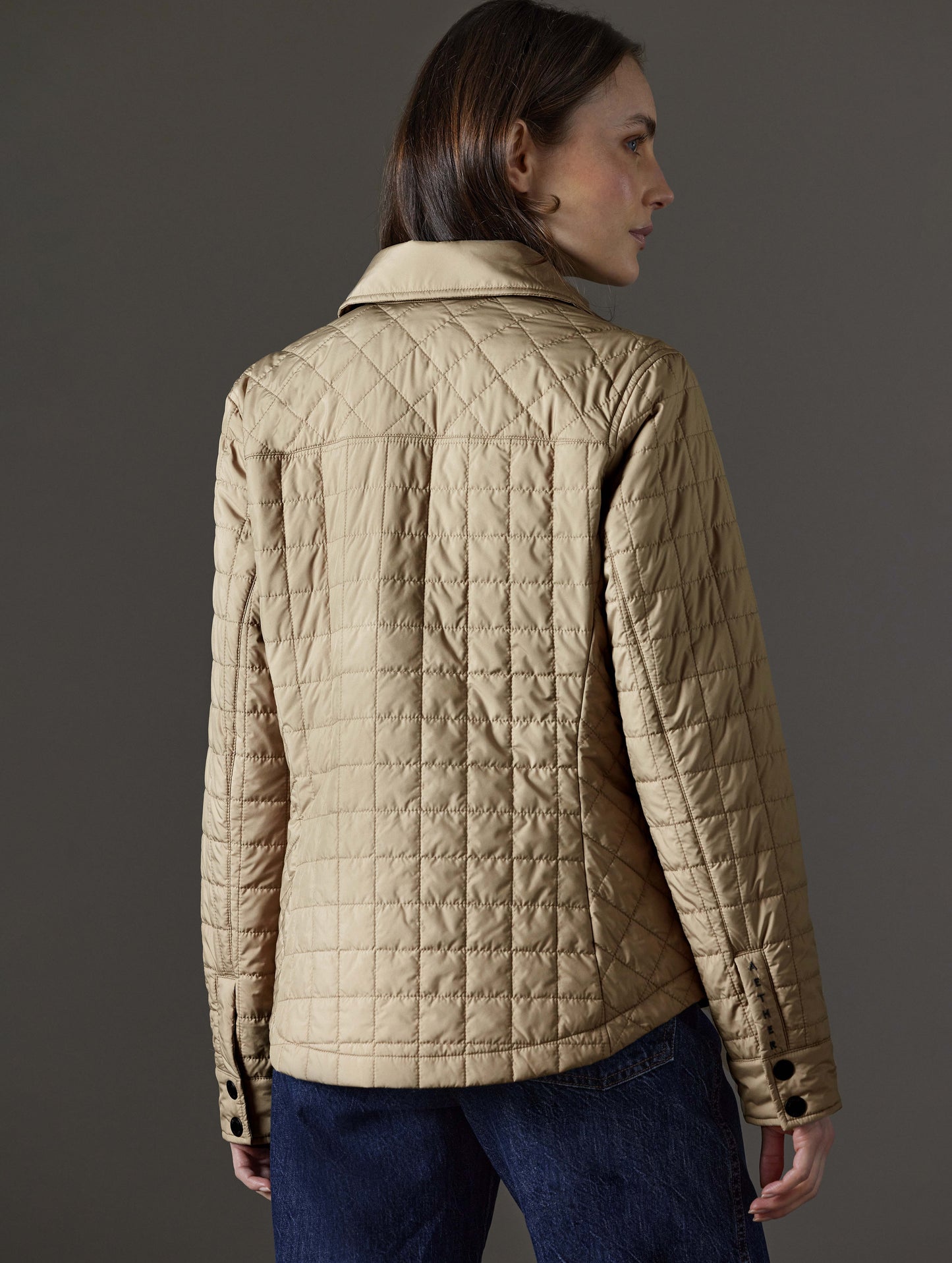 Rear angled view of woman wearing Bardo Shirt Jacket in Chinchilla Brown from AETHER Apparel.