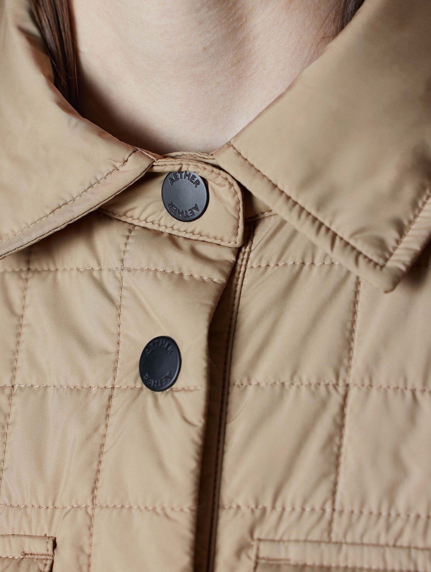 Closeup detailed view of the collar and top snap buttons on the Bardo Shirt Jacket in Chinchilla Brown from AETHER Apparel.