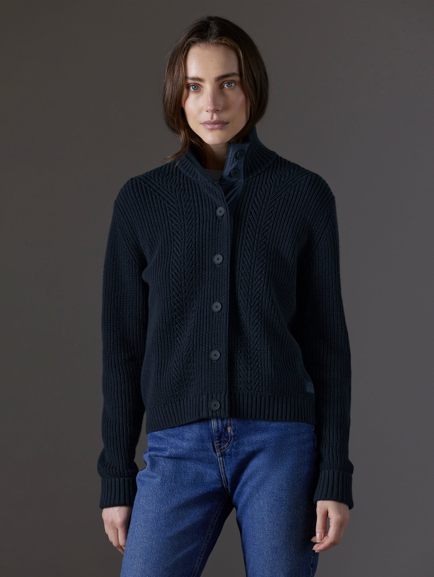 Front view of woman wearing Cato Buttoned Sweater in Total Eclipse dark blue from AETHER Apparel.