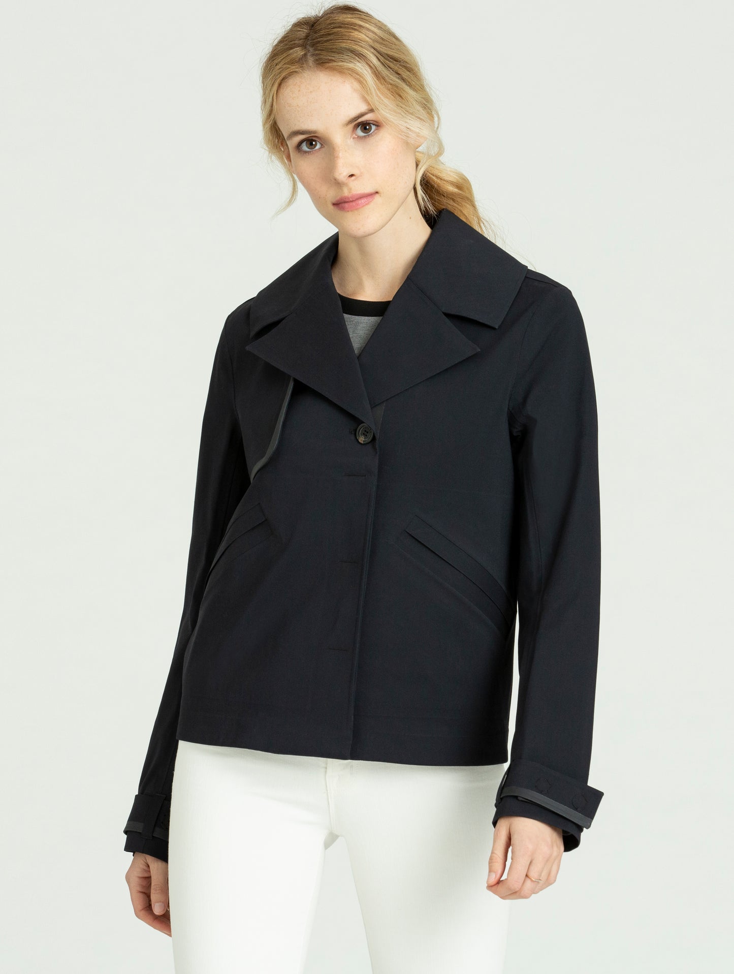 Woman wearing black Cole Jacket from AETHER Apparel.