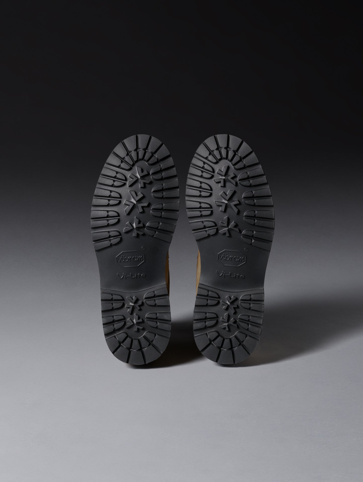 View of Vibram Vi Lite outsoles on bottom of women’s Dolomite Boot in Oak Brown from AETHER Apparel.