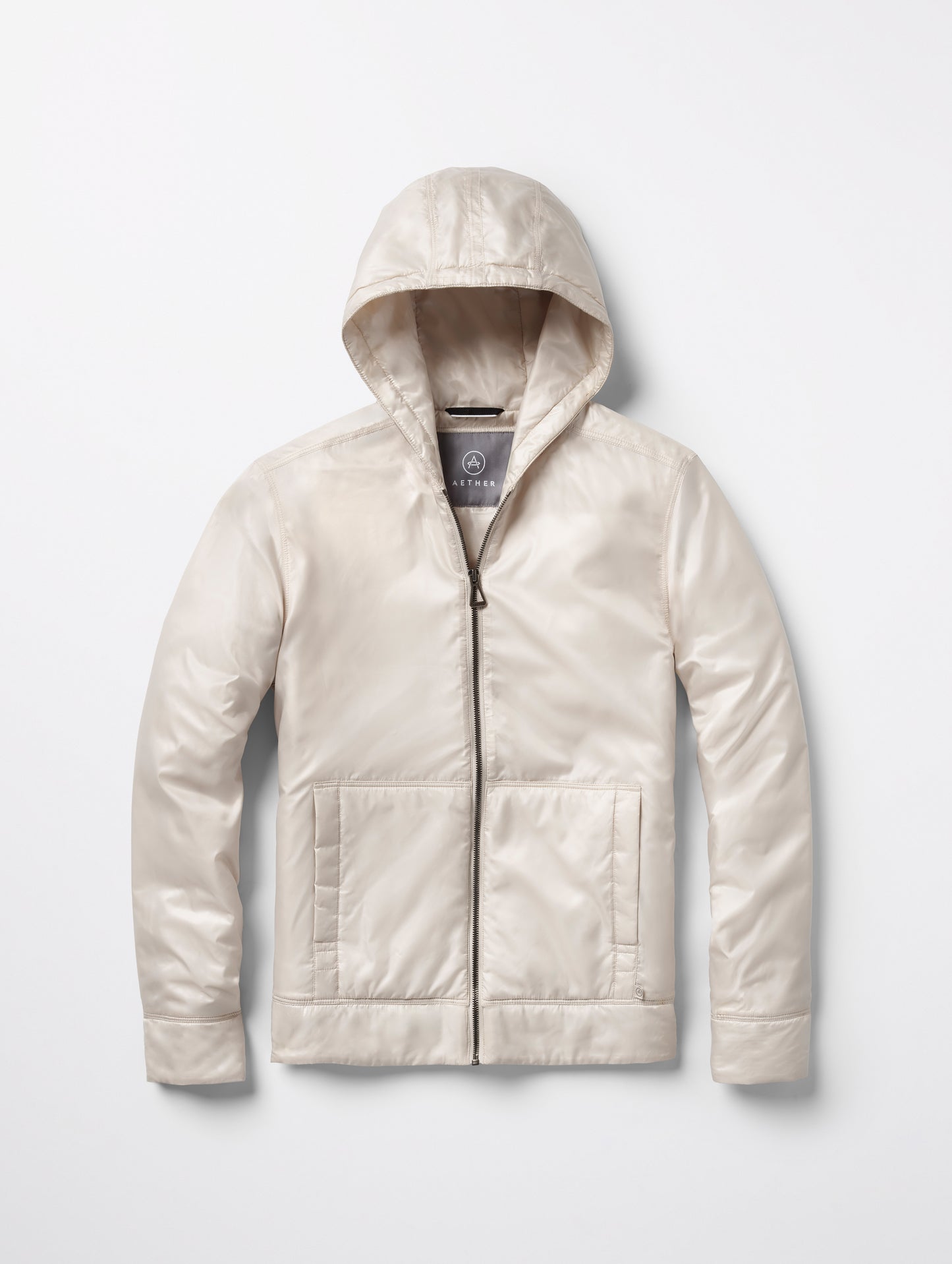 Flat lay of women’s Eco Space Hoodie in Bone white from AETHER Apparel.