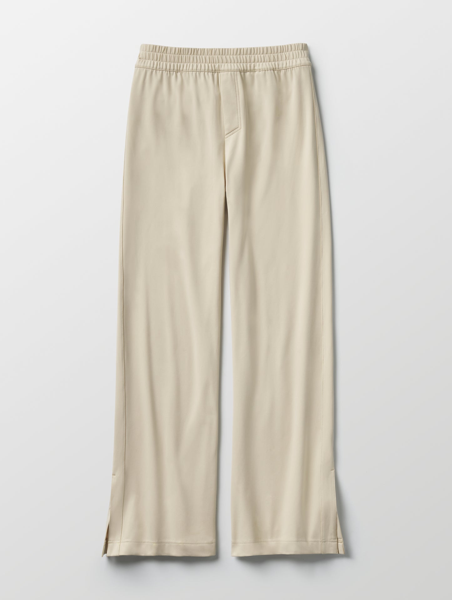 Flat lay of women's Eloise Travel Slim Pant in Bone white from AETHER Apparel.