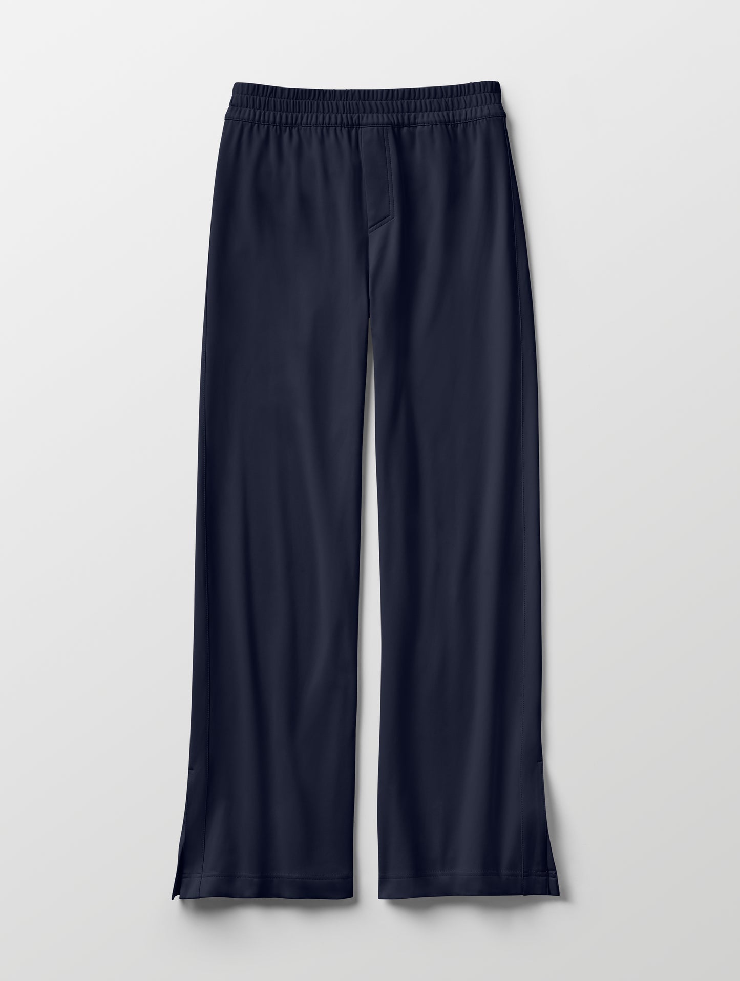 Flat lay of women's Eloise Travel Slim Pant in Total Eclipse dark blue from AETHER Apparel.