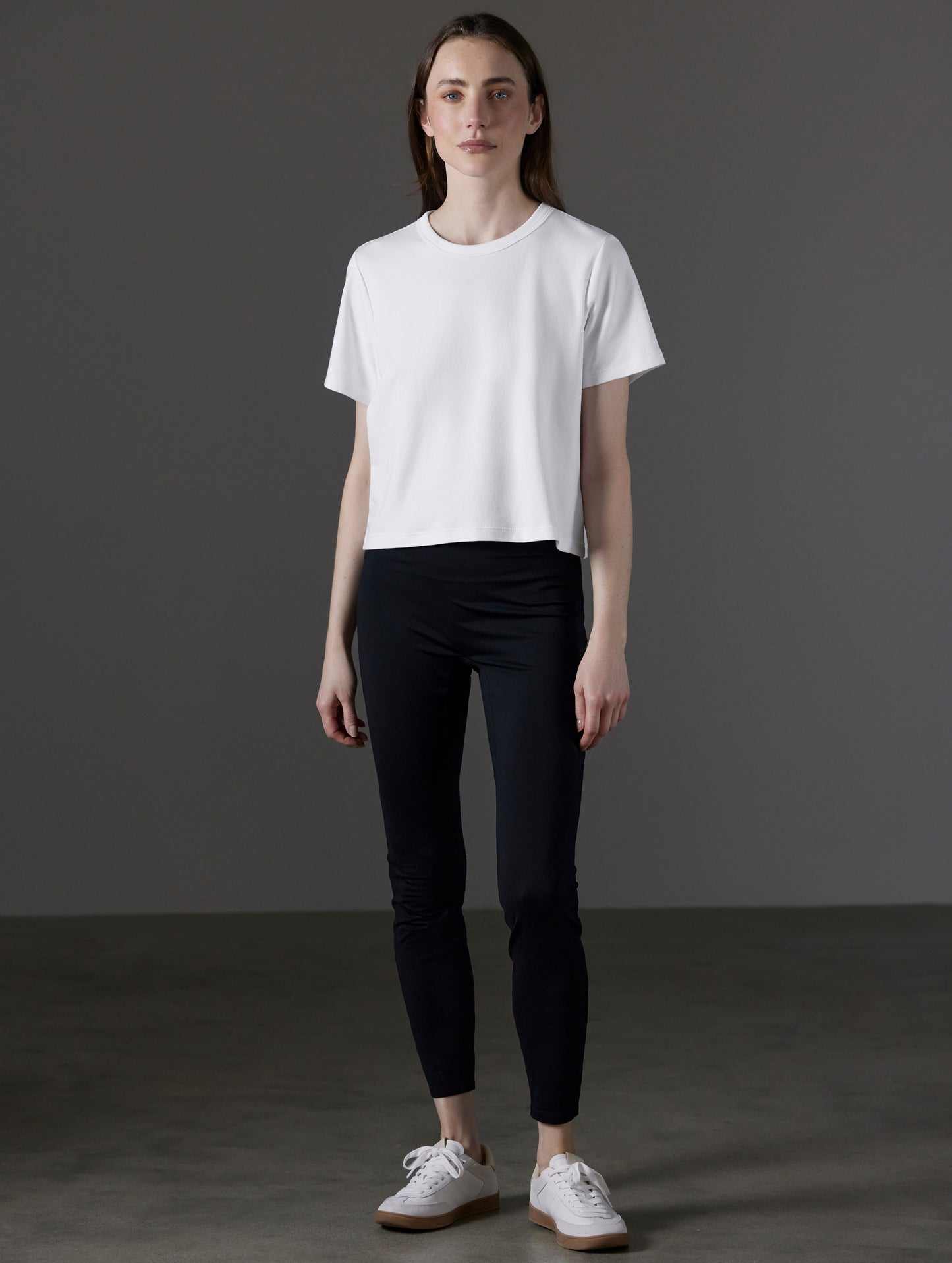 Front full-body view of woman wearing Emery Pima Cropped Tee in White from AETHER Apparel.