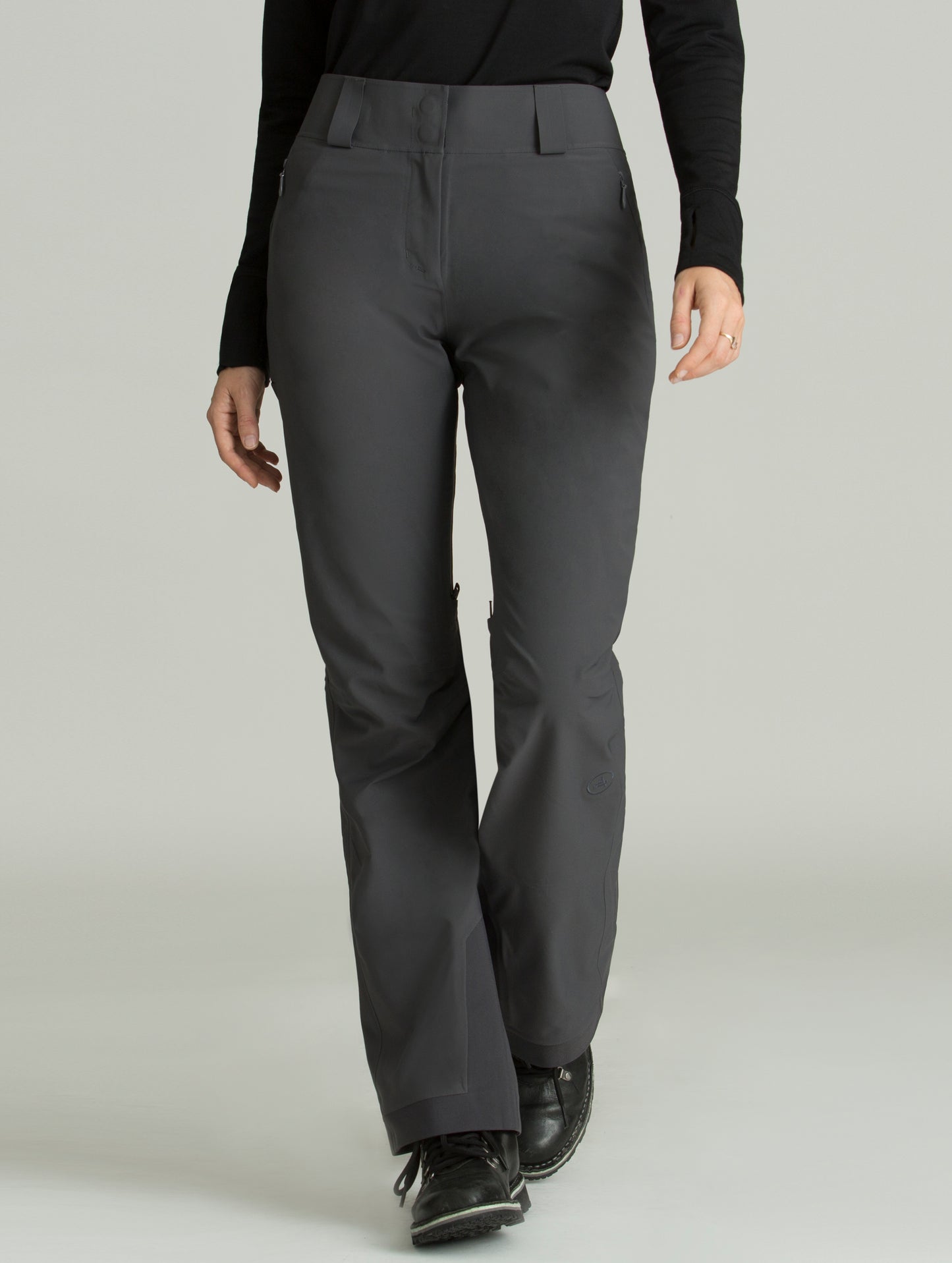 Front view of woman wearing grey Forte Snow Pant from AETHER Apparel.