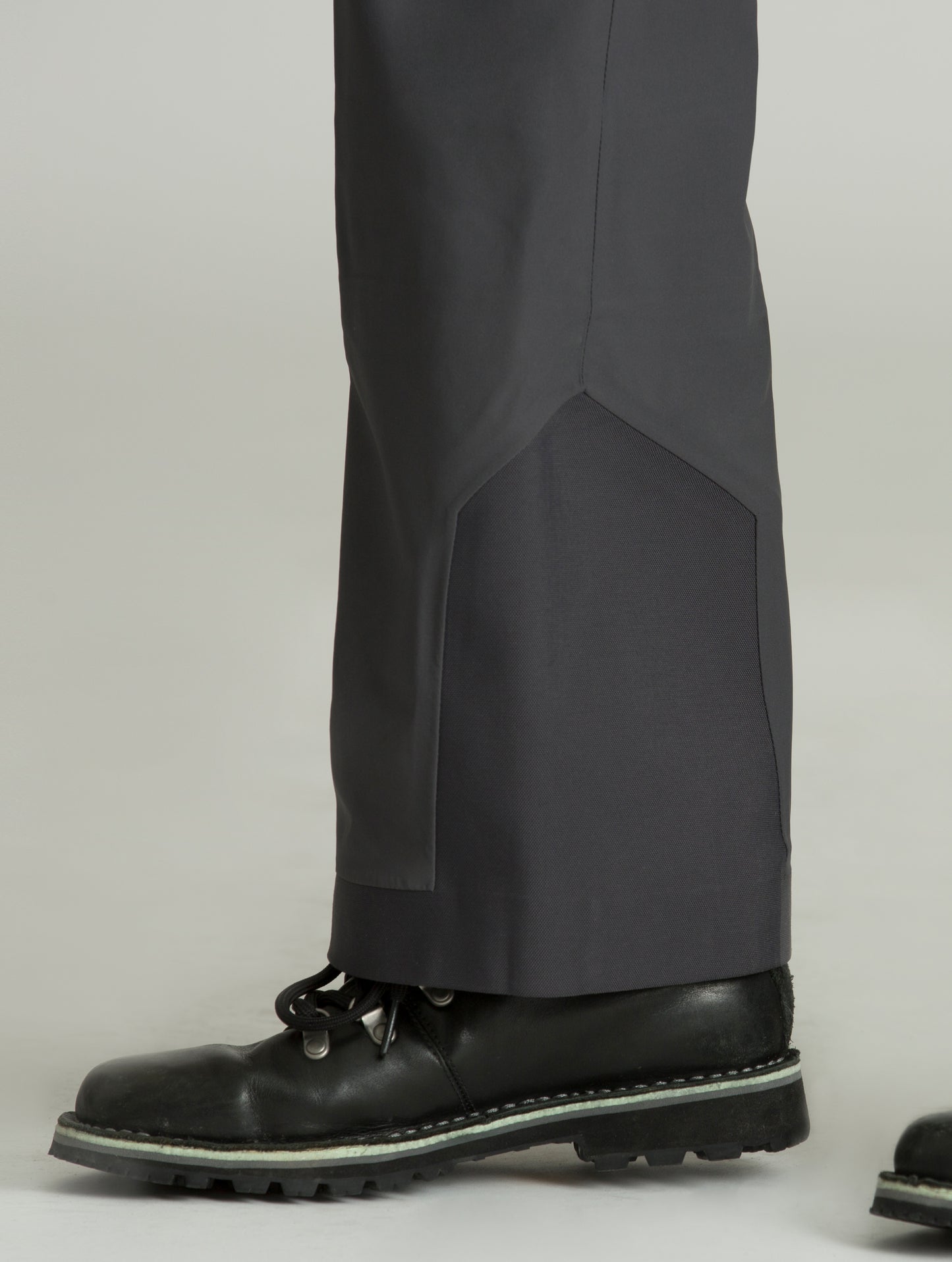 Snow gaiter on bottom right leg of grey Forte Snow Pant from AETHER Apparel.