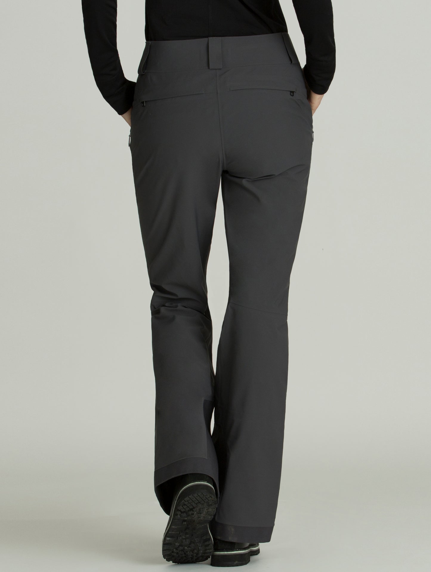 Rear view of woman wearing grey Forte Snow Pant from AETHER Apparel.