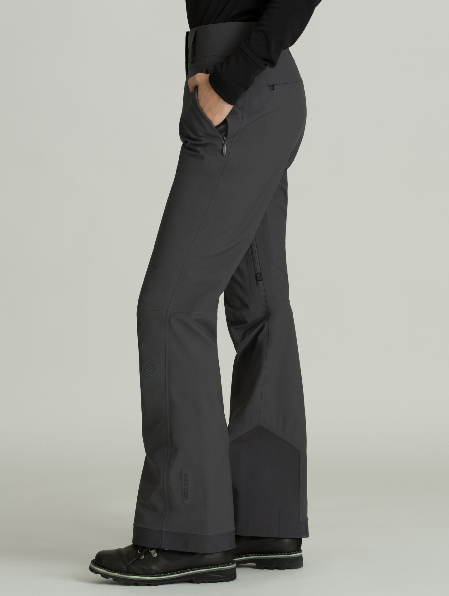 Side view of woman wearing grey Forte Snow Pant from AETHER Apparel.