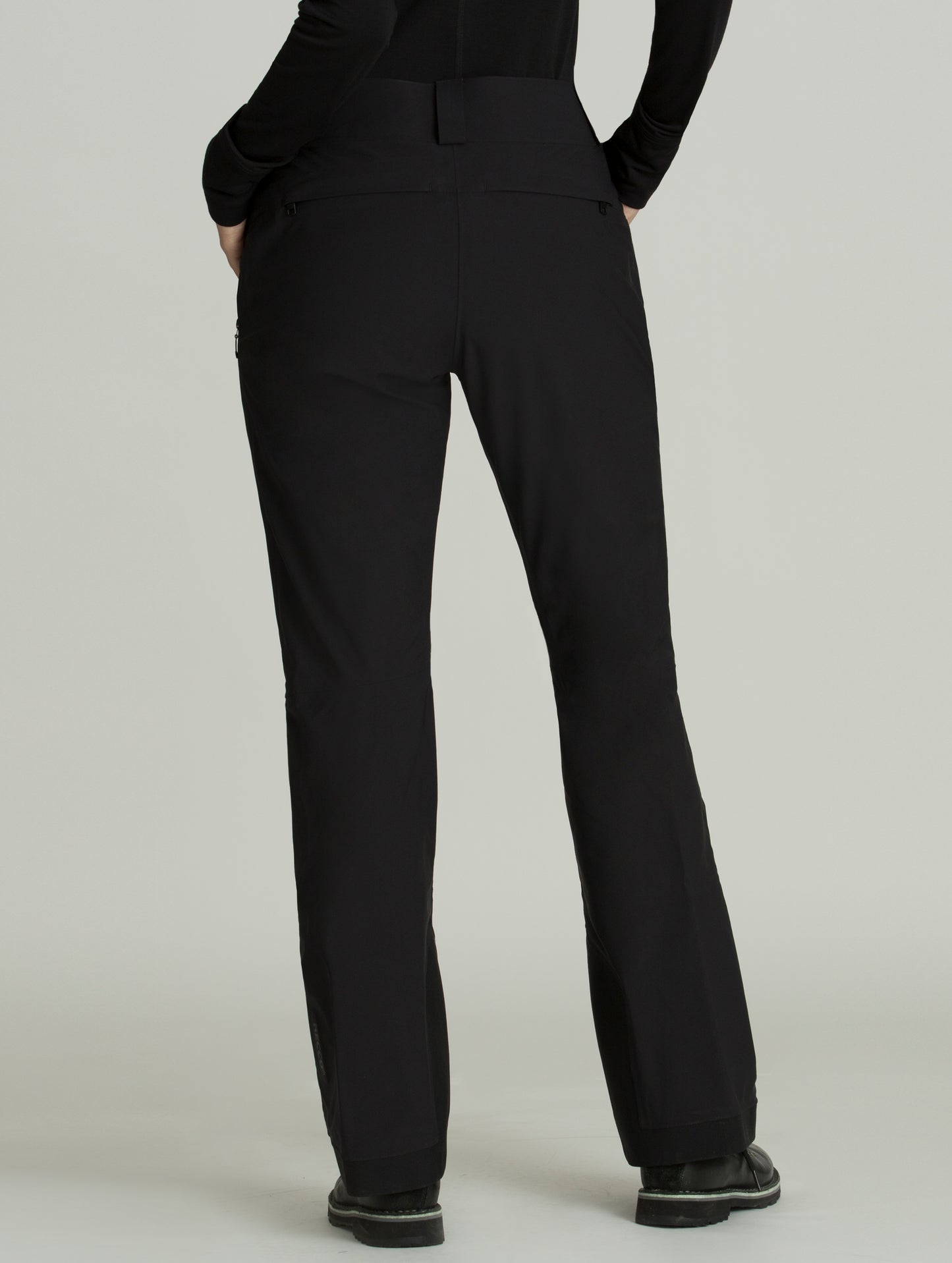 Back view of woman wearing black Forte Snow Pant from AETHER Apparel.