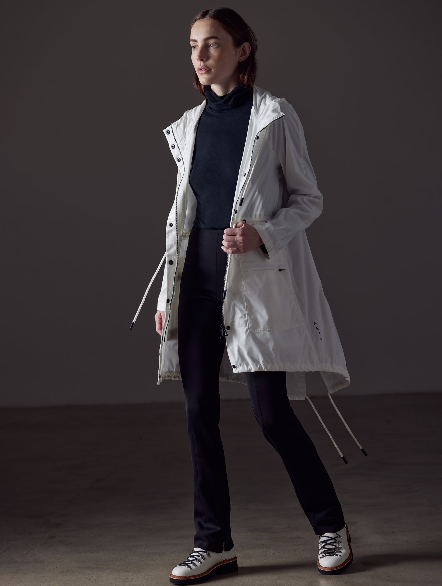 woman wearing white jacket from AETHER Apparel