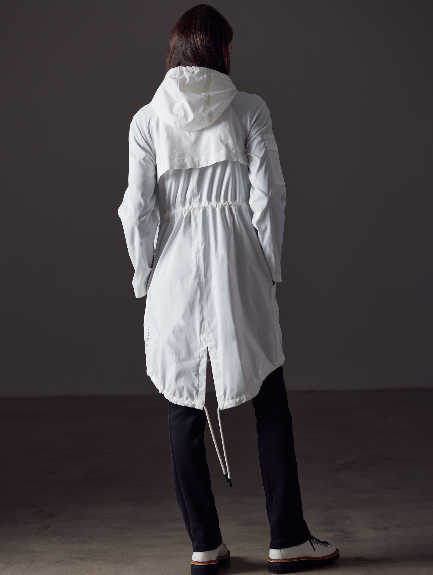 woman wearing white jacket from AETHER Apparel
