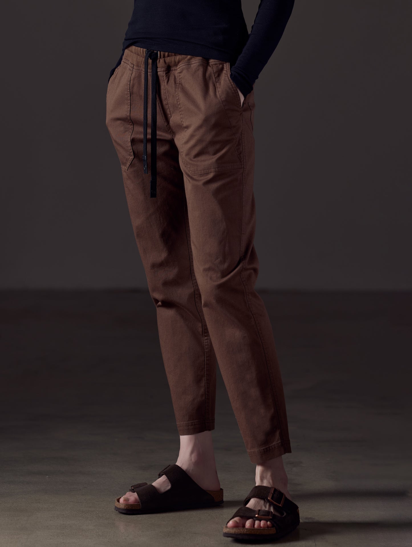 Woman wearing brown cotton pant from AETHER Apparel