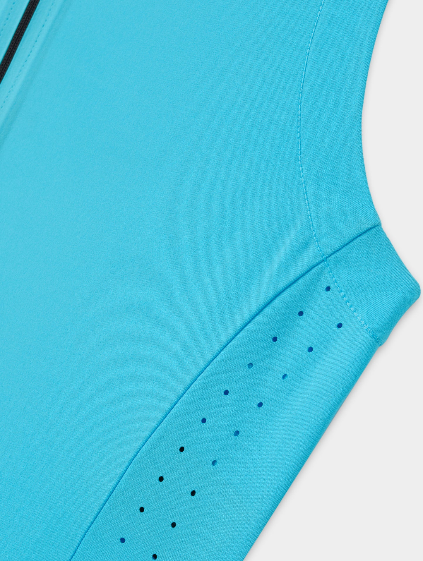 Flat lay view of the laser-cut side panel ventilation on the Kora Sunproof Tank Top in Sky Blue from AETHER Apparel.