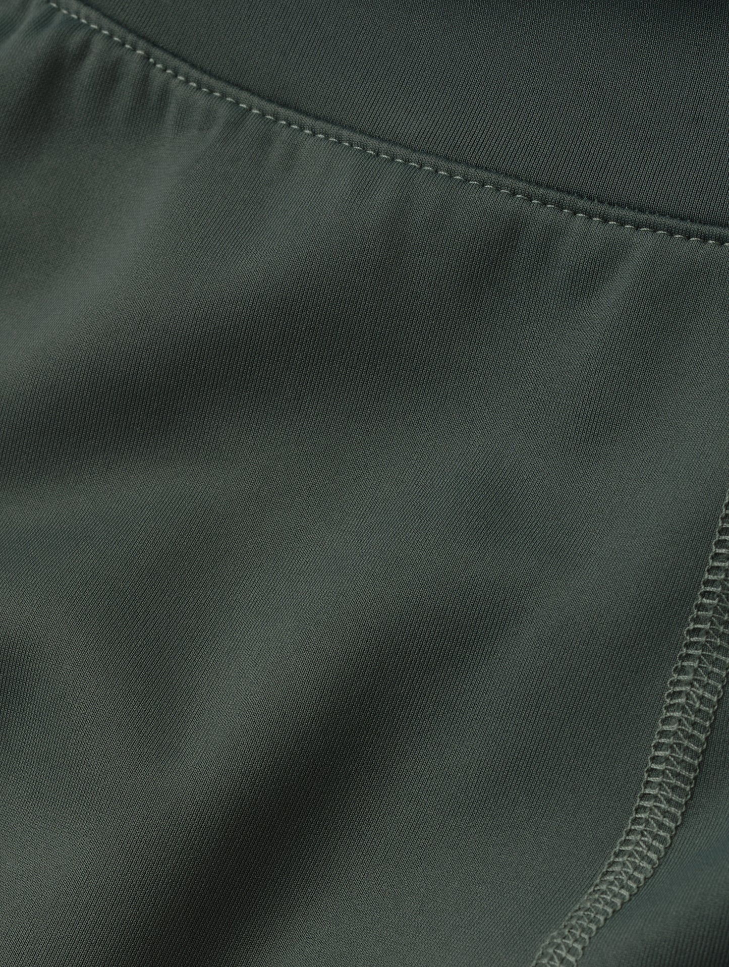 Closeup detailed look at the fabric of the Laurel Legging in Saville Green from AETHER Apparel.