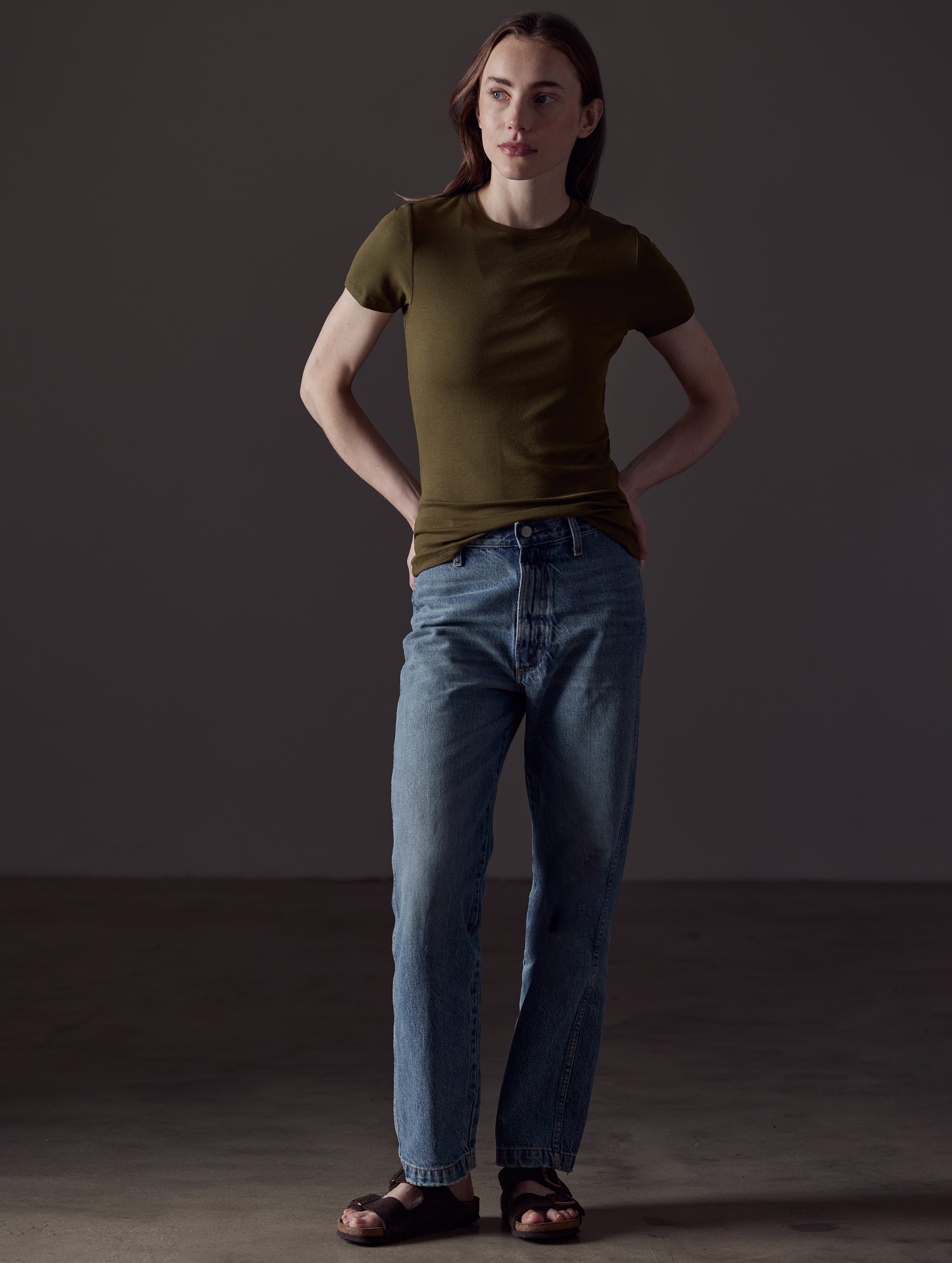 Front full-body view of woman wearing Legacy Short-Sleeve Crew in Command Green from AETHER Apparel.