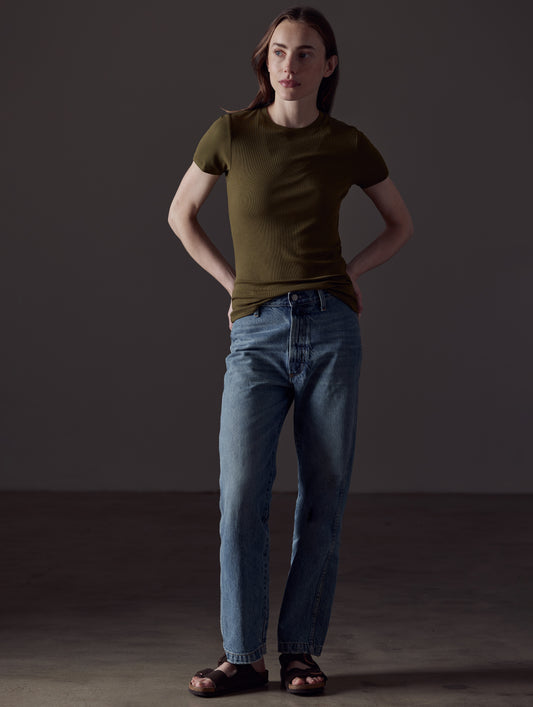 Front full-body view of woman wearing Legacy Short-Sleeve Crew in Command Green from AETHER Apparel.