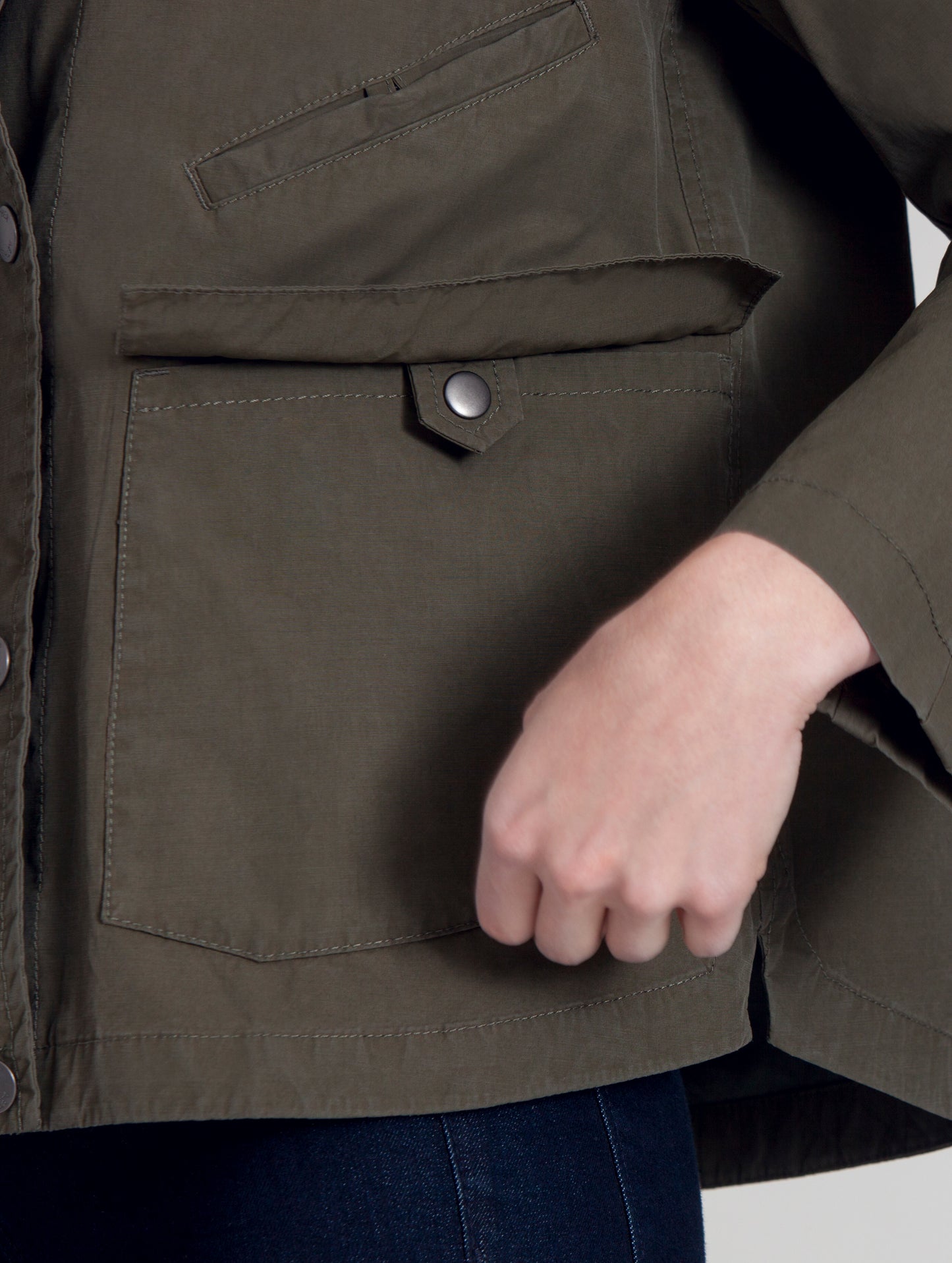 Left pocket of women's green Lenox Jacket from AETHER Apparel.