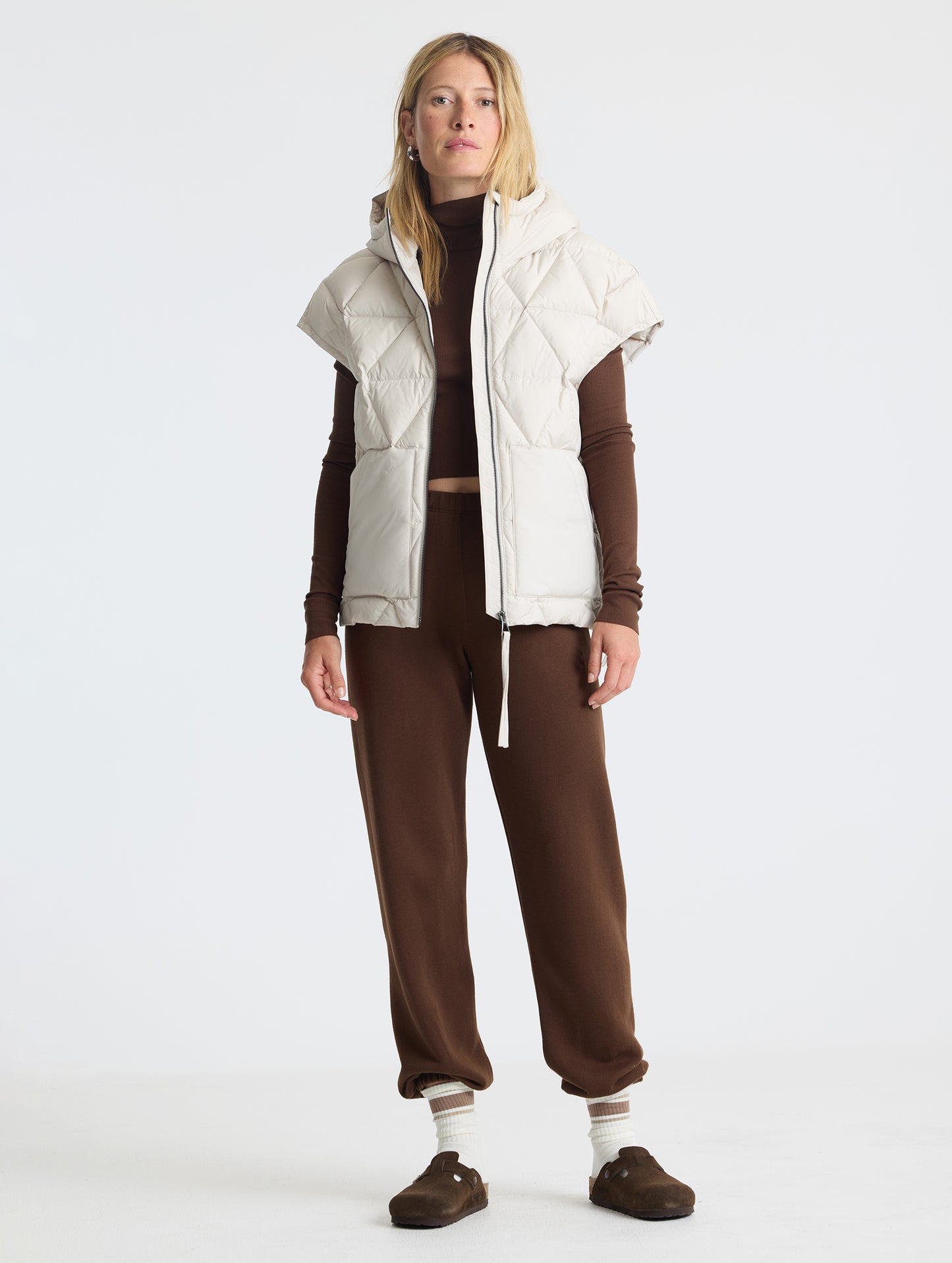Full body view of woman wearing Mailen Oversized Vest in Bone White from AETHER Apparel.