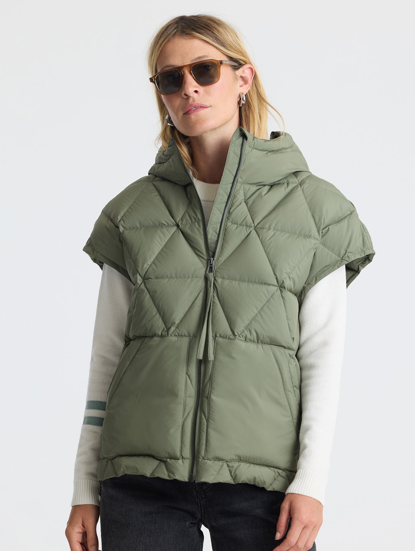 Upper body view of woman wearing zipped Mailen Oversized Vest in Fern Green from AETHER Apparel.