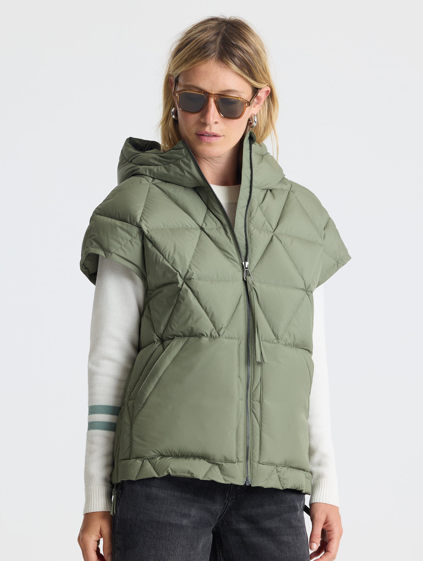 Upper body 3/4 view of woman wearing zipped Mailen Oversized Vest in Fern Green from AETHER Apparel.