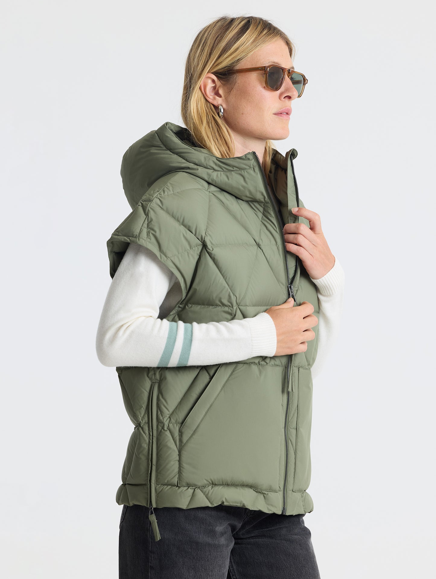 Right profile view of woman wearing Mailen Oversized Vest in Fern Green from AETHER Apparel.