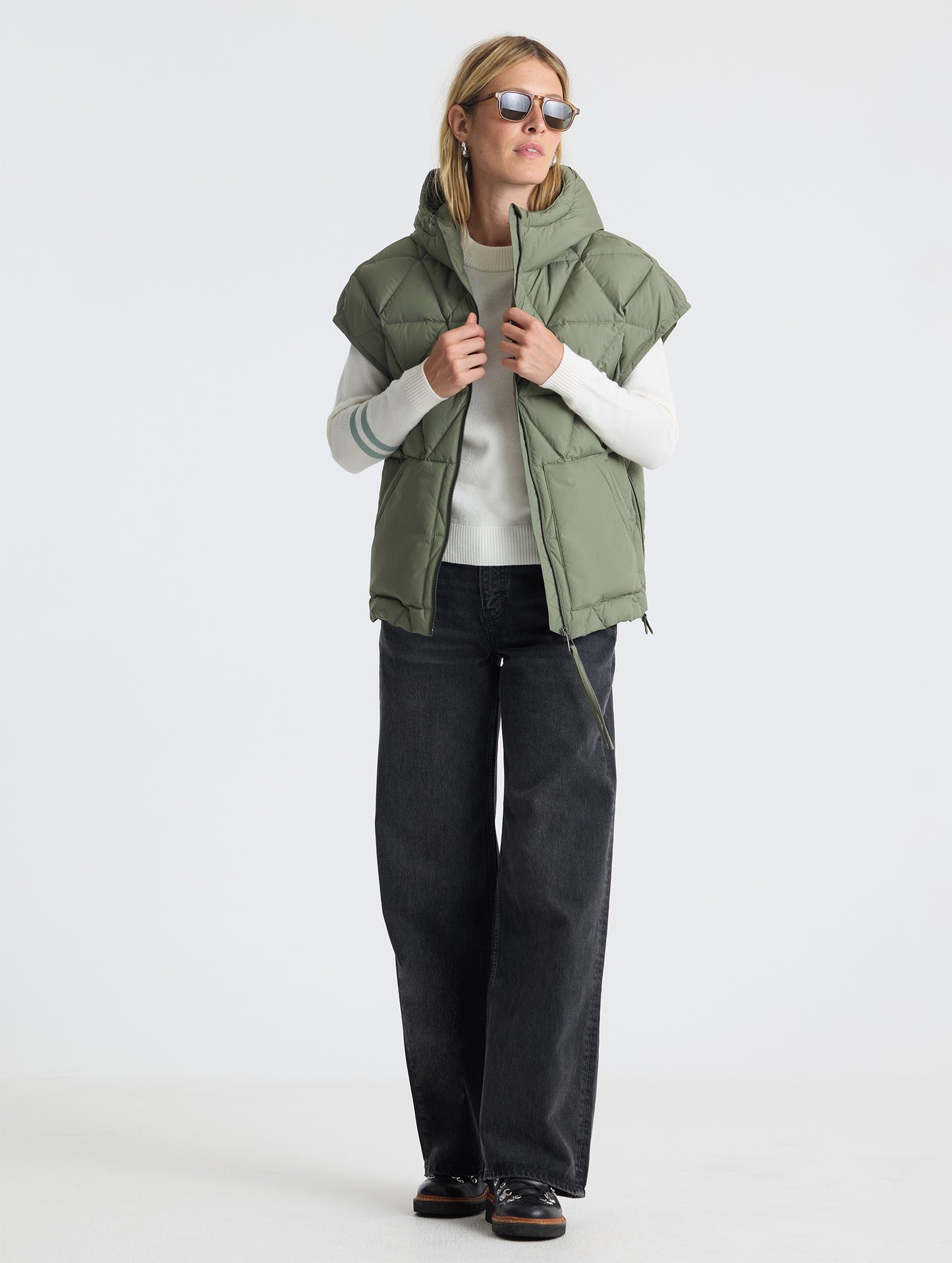 Full body view of woman wearing zipped Mailen Oversized Vest in Fern Green from AETHER Apparel.
