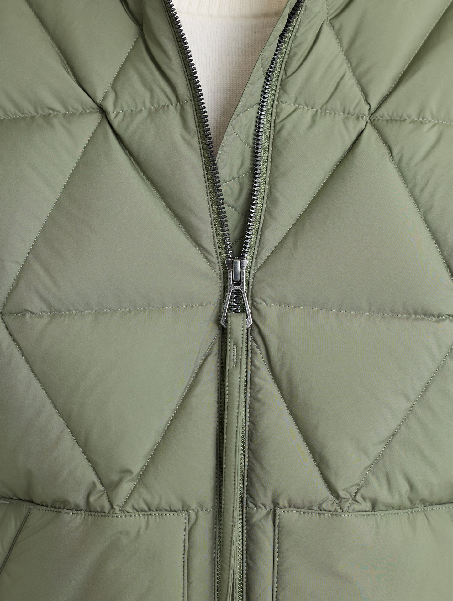 Closeup front zipper view of Mailen Oversized Vest in Fern Green from AETHER Apparel.