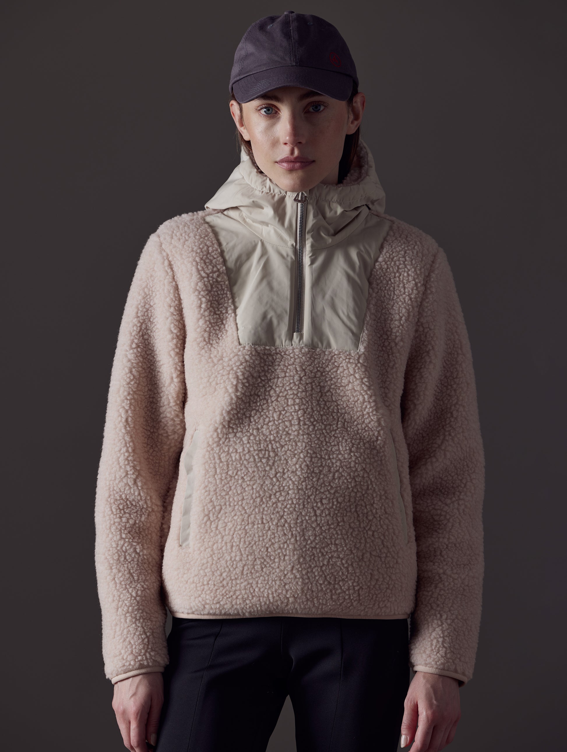 Upper body view of woman wearing pink Narrow Pullover from AETHER Apparel.