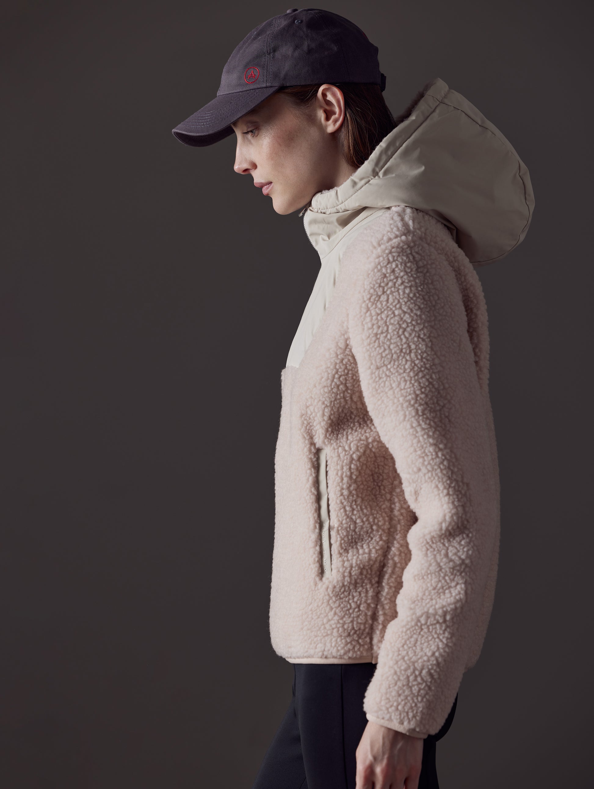 Right side view of woman wearing pink Narrow Pullover from AETHER Apparel.