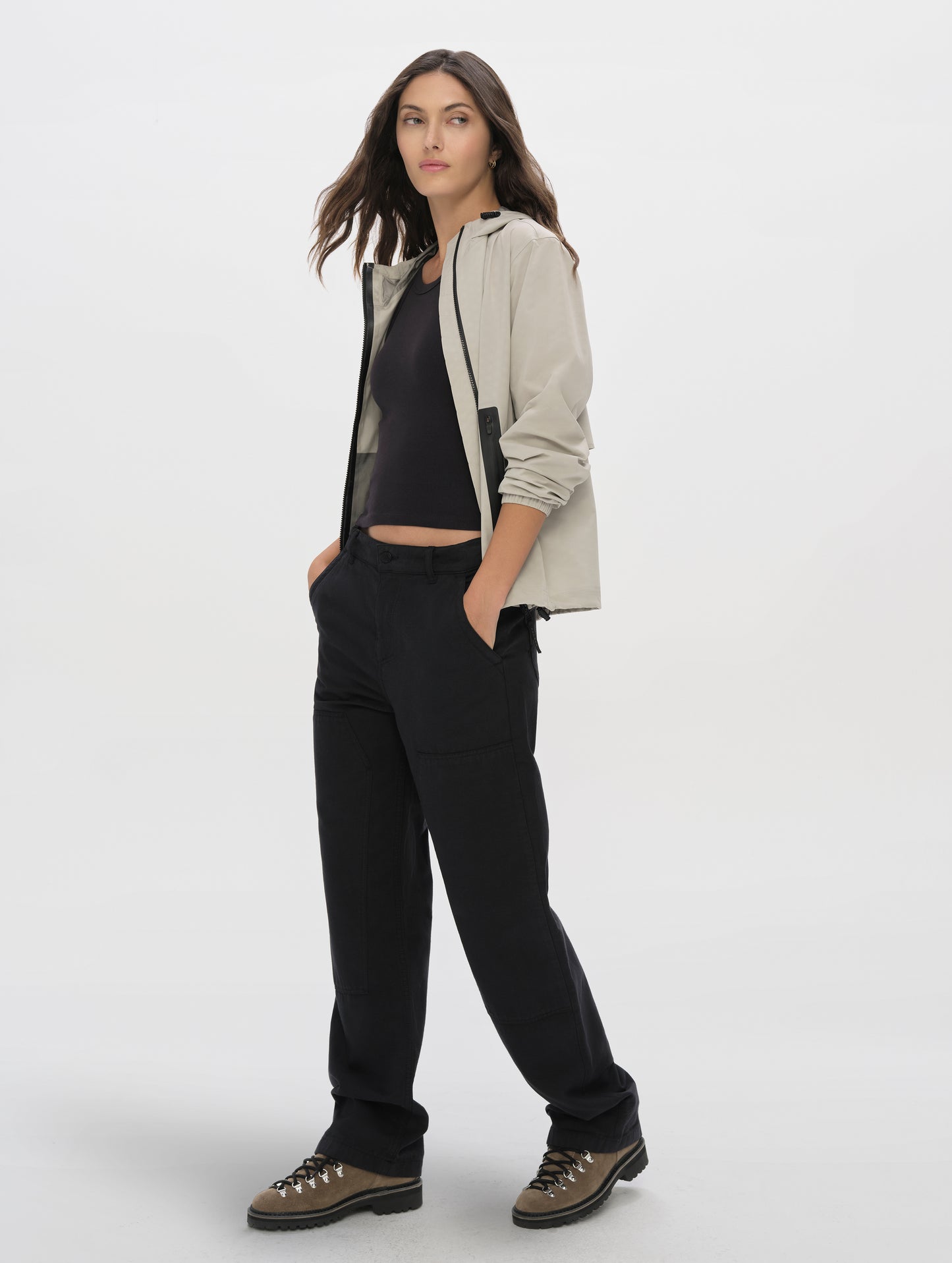 Front angled full-body view of woman wearing the Natalie Utility Pant in Onyx Black from AETHER Apparel.