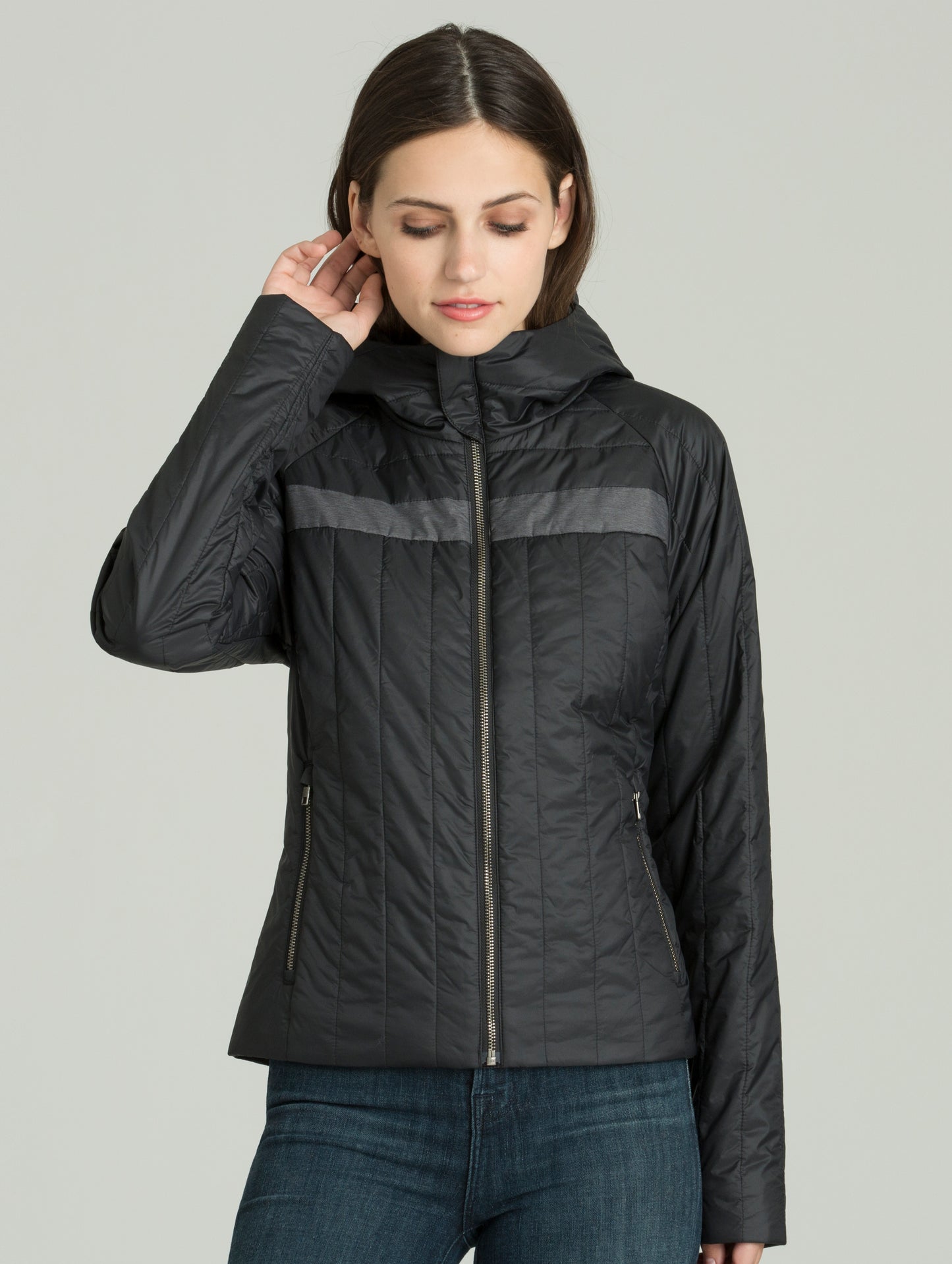 Woman wearing black Nell Jacket from AETHER Apparel.
