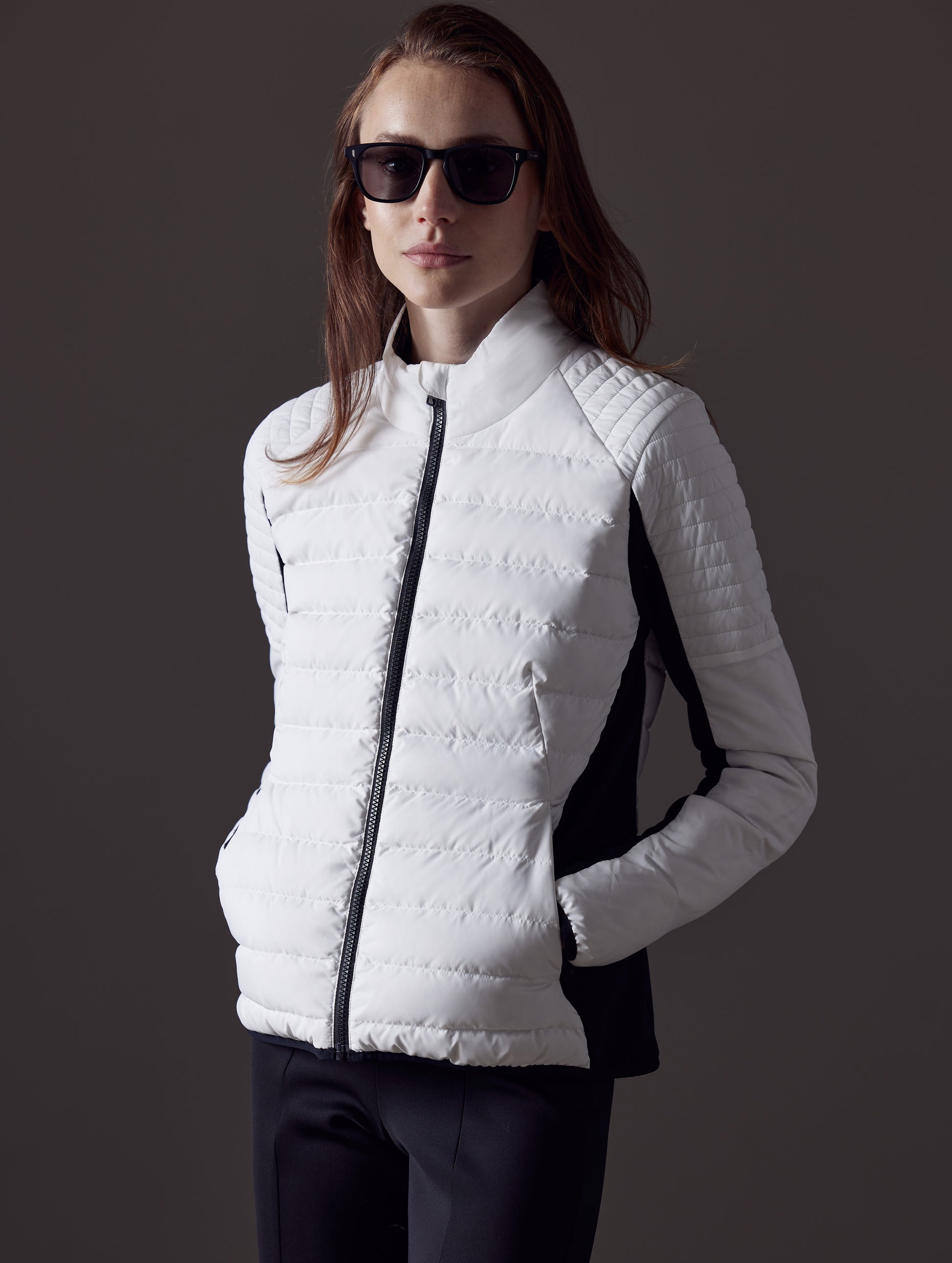 Front angled view of woman wearing Ozone Jacket in White from AETHER Apparel.