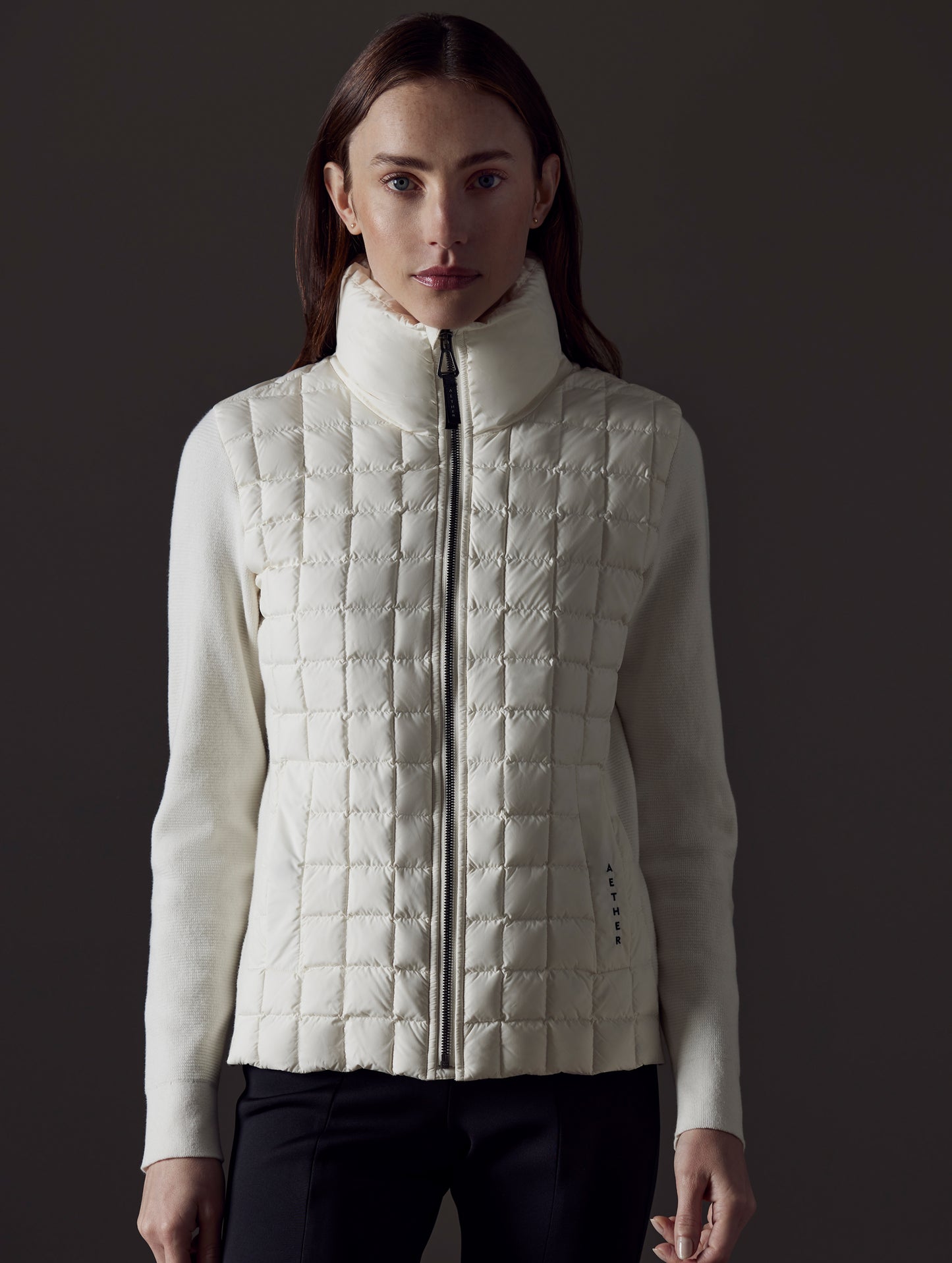 Front view of woman wearing Phase Full-Zip in Winter White from AETHER Apparel.