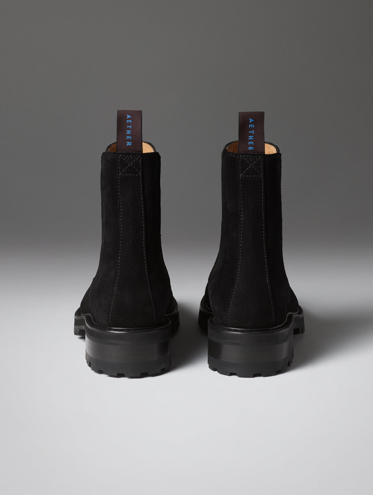 Rear view of the Reign Chelsea Boot in Onyx Black from AETHER Apparel.