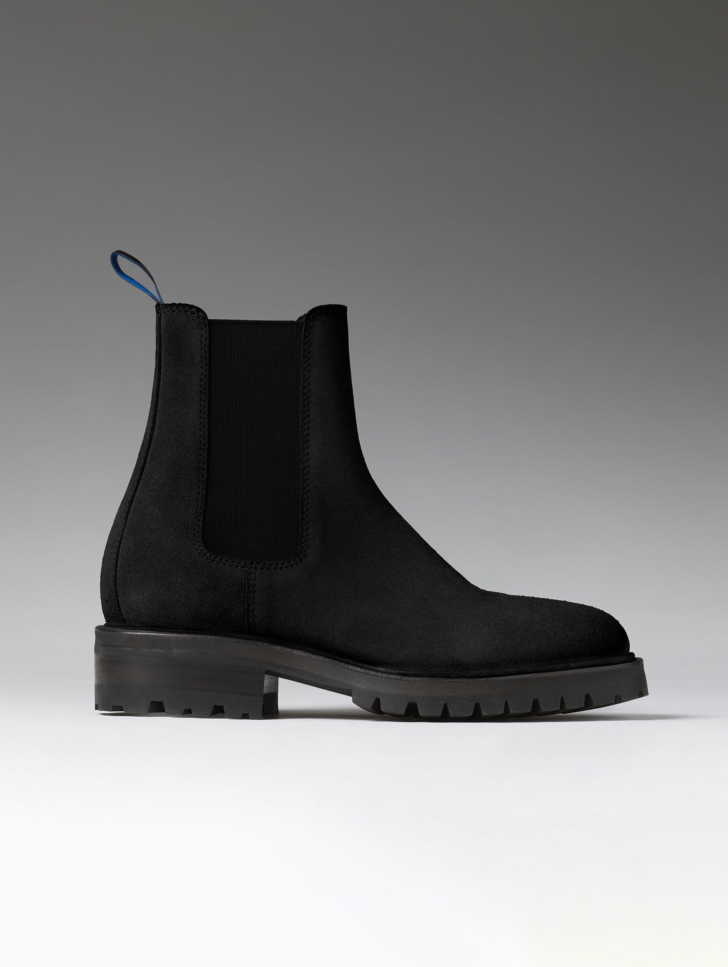 Side profile view of the Reign Chelsea Boot in Onyx Black from AETHER Apparel.