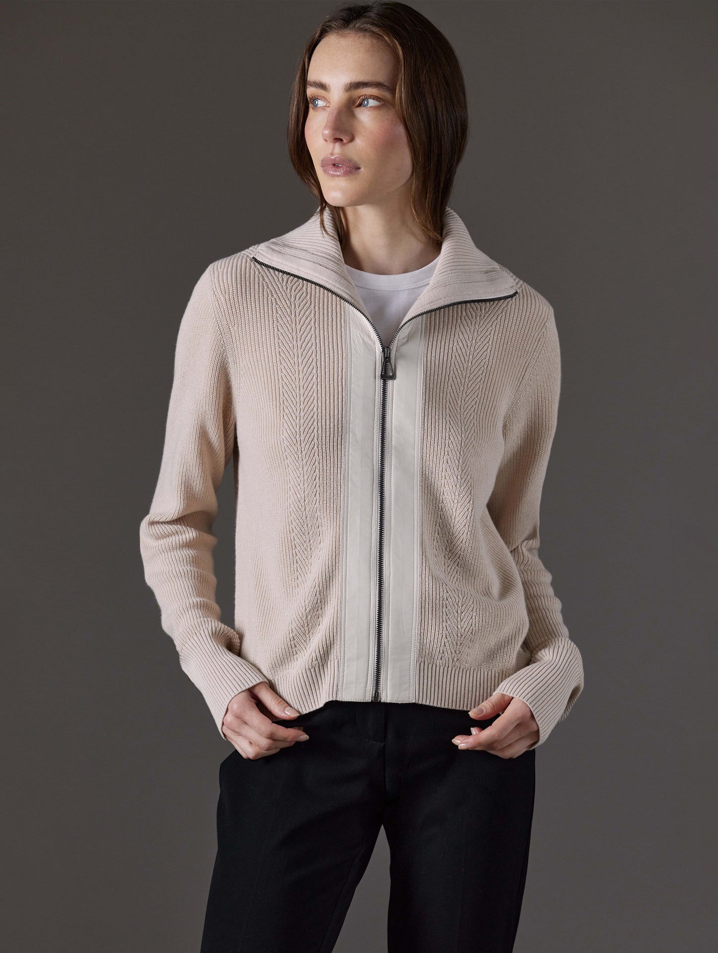 Front view of woman wearing Rhea Full-Zip Sweater in Bone white from AETHER Apparel.