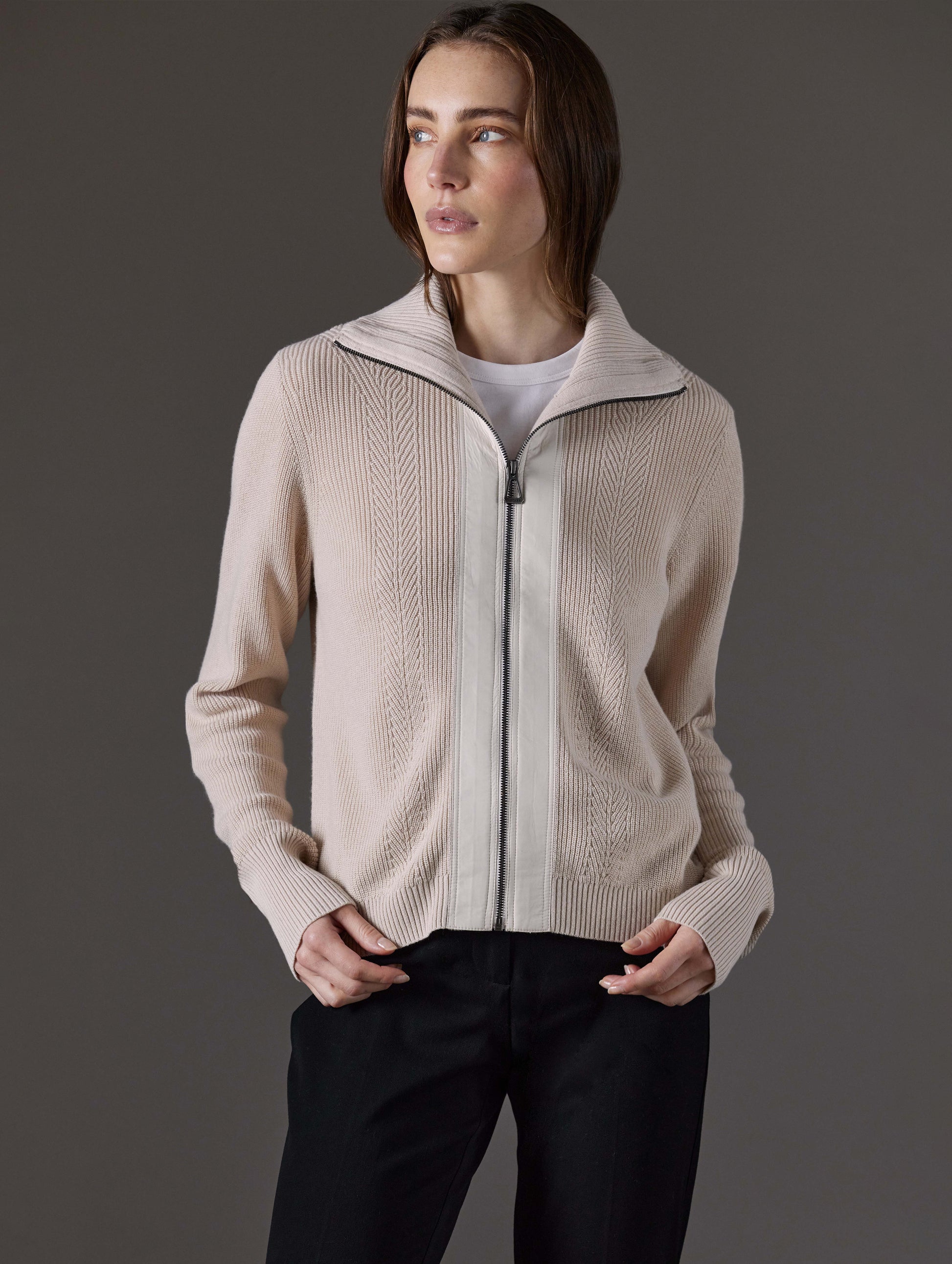 Front view of woman wearing Rhea Full-Zip Sweater in Bone white from AETHER Apparel.