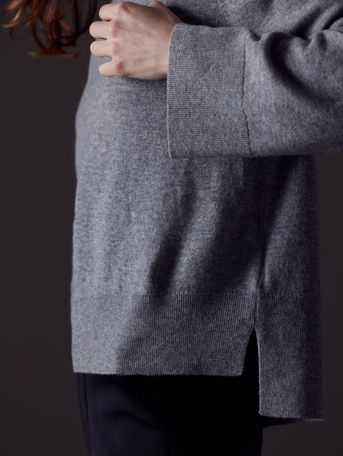 Closeup detailed view of Cashmere construction of women's Leigh Cashmere Turtleneck Sweater in Heather Grey from AETHER Apparel.